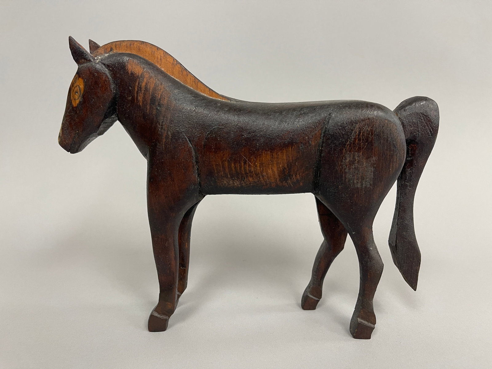 CARVED HORSE: CARVED HORSE 19TH C, PINE, ORIGINAL BLACK PAINT, FULL BODIED, EXCELLENT CONDITION.