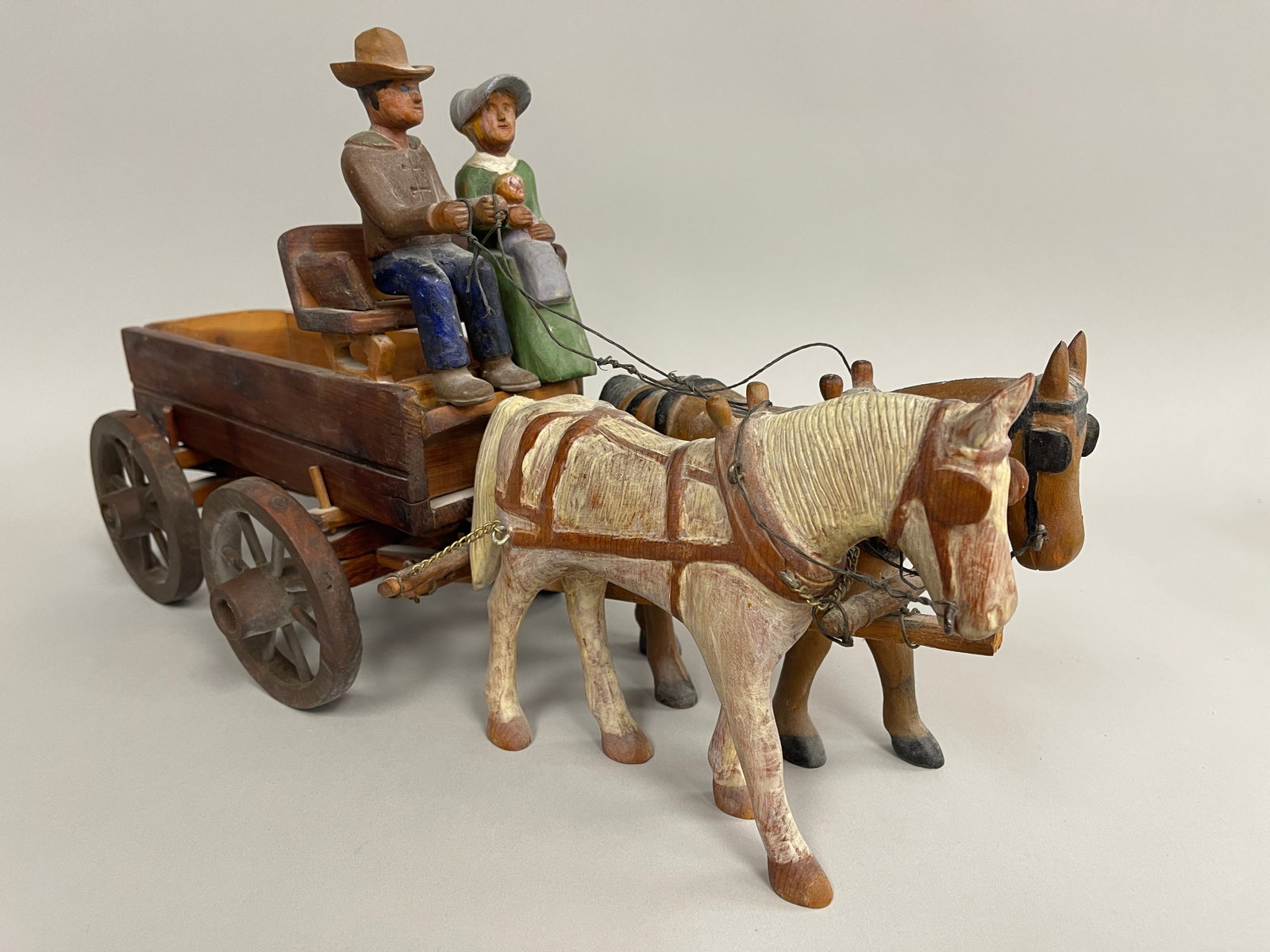 HORSE TEAM WAGON CARVING: HORSE TEAM WAGON CARVING C 1900, PINE, ORIGINAL PAINT, DEPICTING MAN & WOMAN IN HORSES DRAWN CART, EXCELLENT CONDITION.