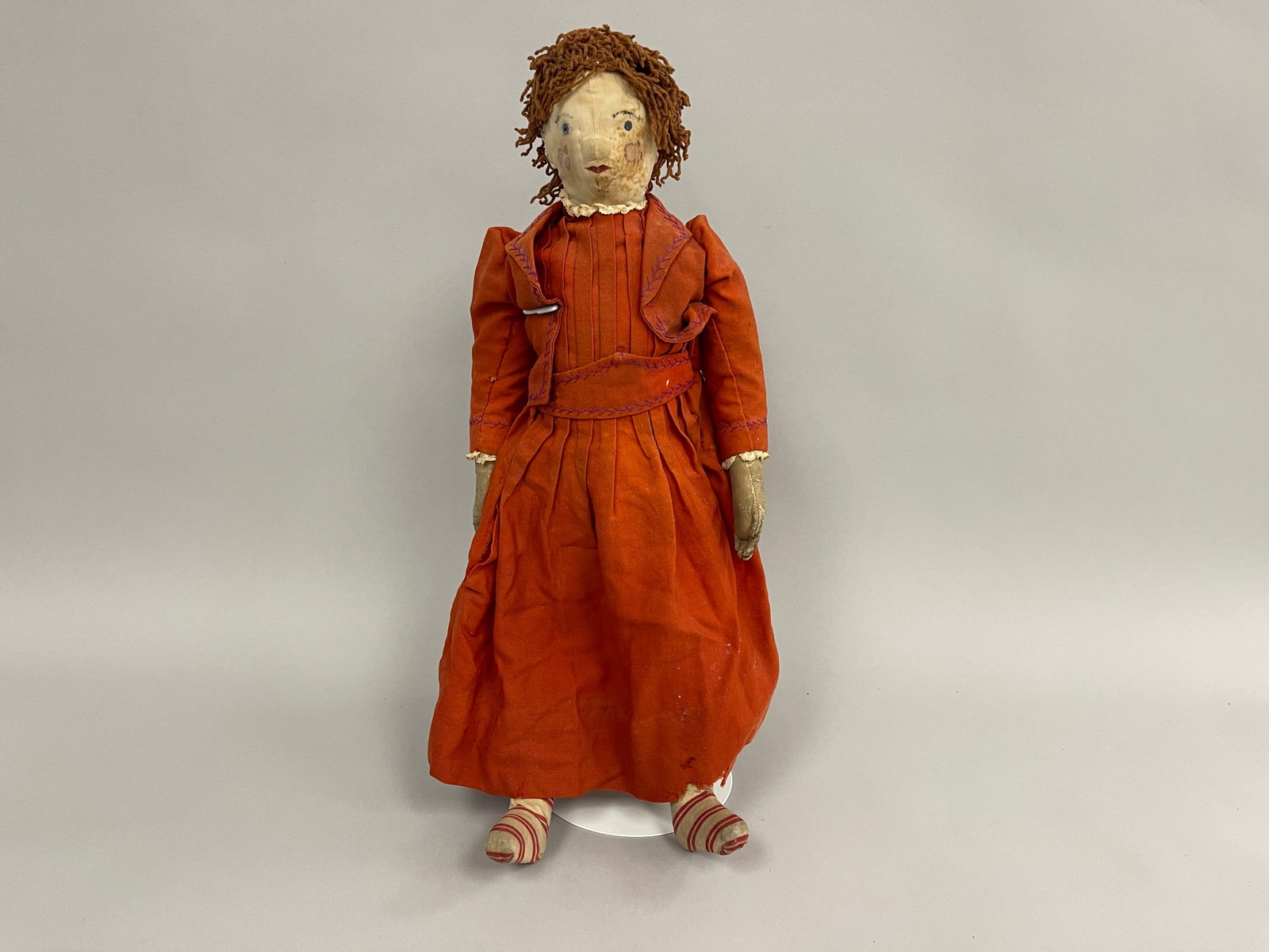 GIRL RAG DOLL: GIRL RAG DOLL 19TH C, PAINTED FACE, RED DRESS & COAT, EXCELLENT CONDITION.