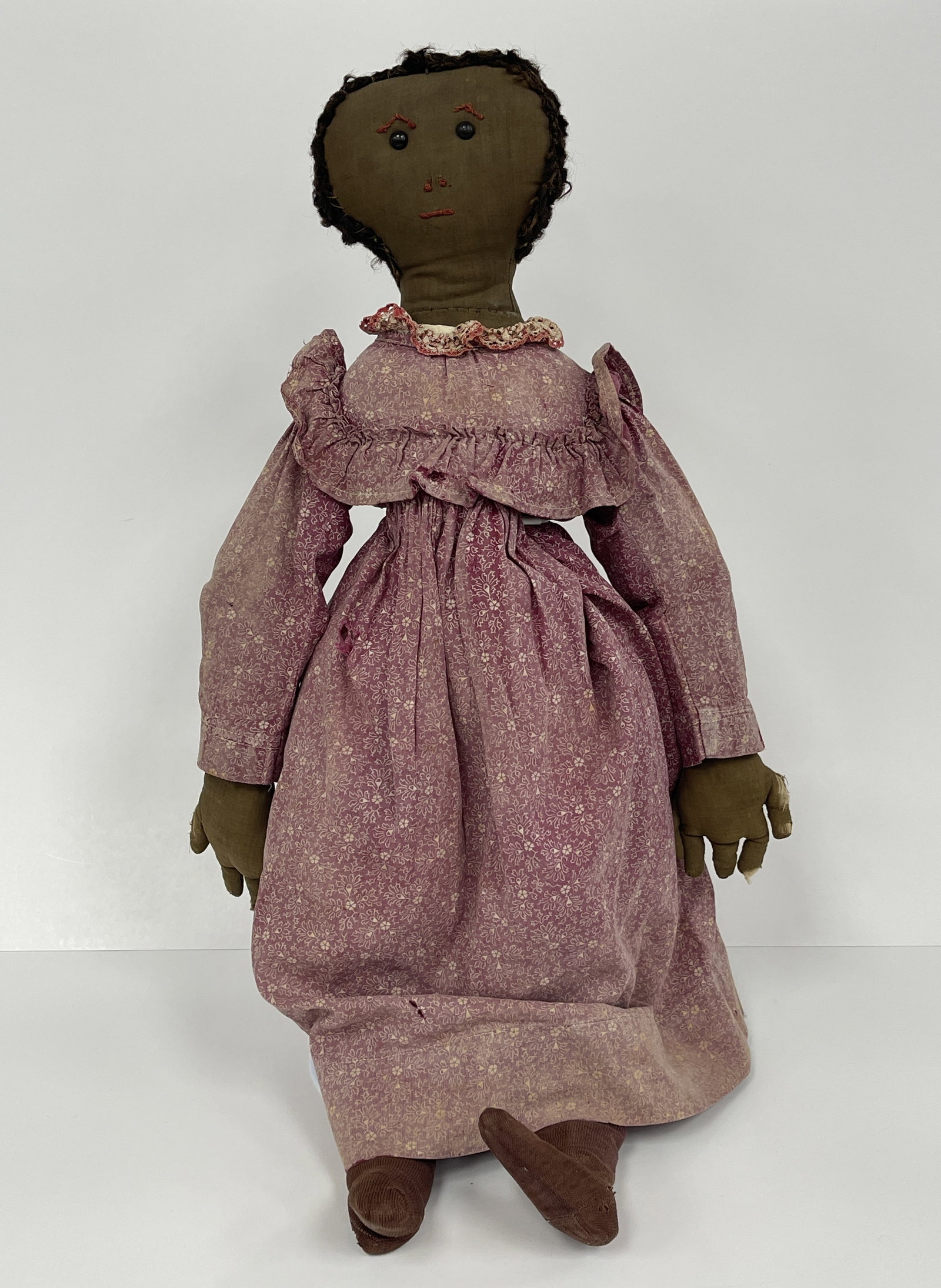 BLACK GIRL RAG DOLL: BLACK GIRL RAG DOLL 19TH C, EMBROIDERED FACE, BEAD EYES, PINK DRESS, EXCELLENT CONDITION.