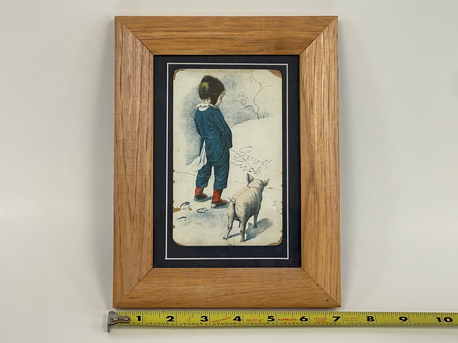 BOY PEEING IN SNOW TRADE CARD: BOY PEEING IN SNOW TRADE CARD “GOOD LUCK 19TH C, FRAMED, MINOR IMPERFECTIONS, VG CONDITION.
