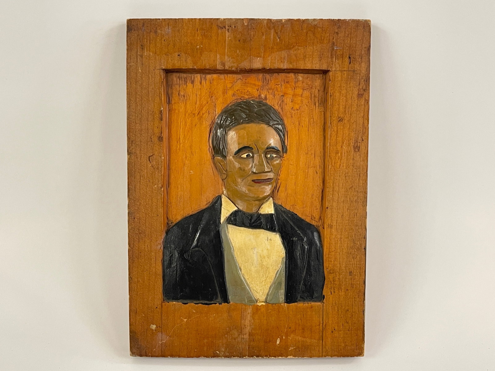 BLACK BUST CARVED PAINTING: HALF ROUND BLACK BUST CARVED PAINTING 9TH C, PINE, RELIEF CARVED, ORIGINAL PAINT, EXCELLENT CONDITION