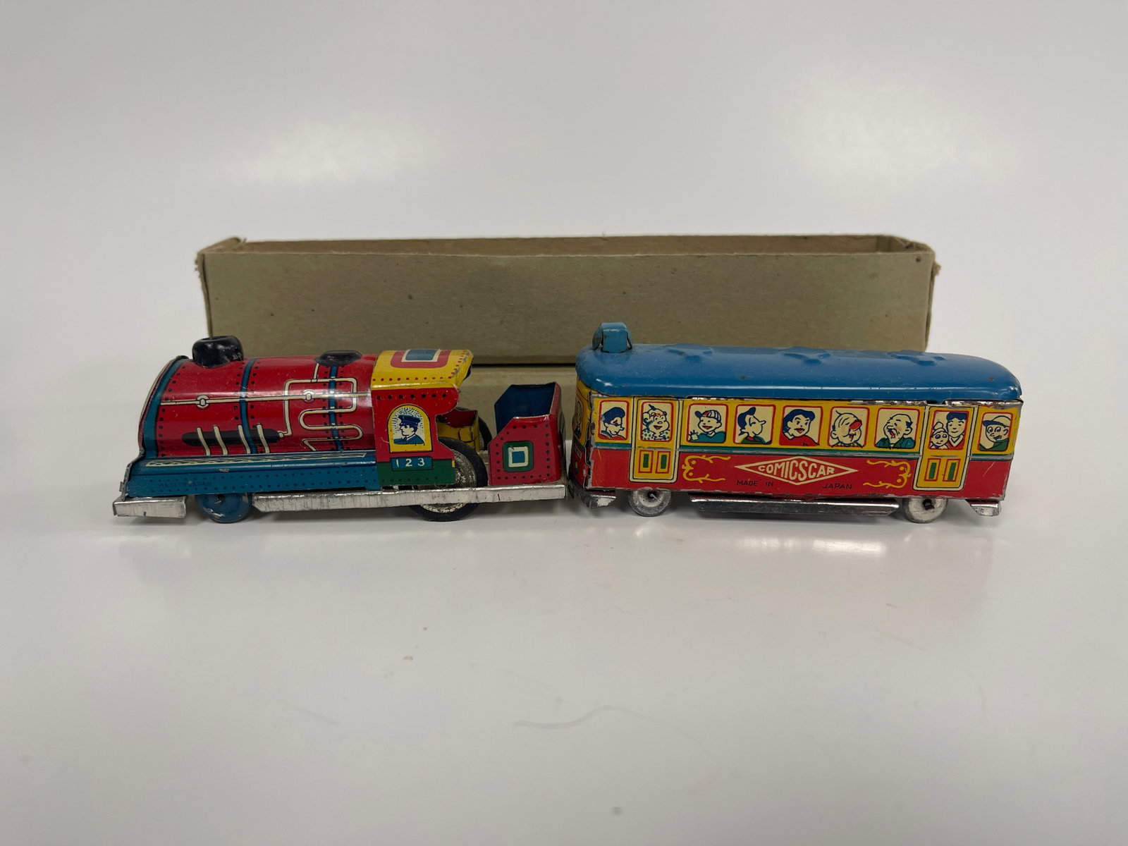 2 PIECE TRAIN: 2 PIECE TRAIN C 1940’S, NEW IN BOX, COMIC CHARACTERS, PRESSED STEEL, COLORFUL, MINT CONDITION.