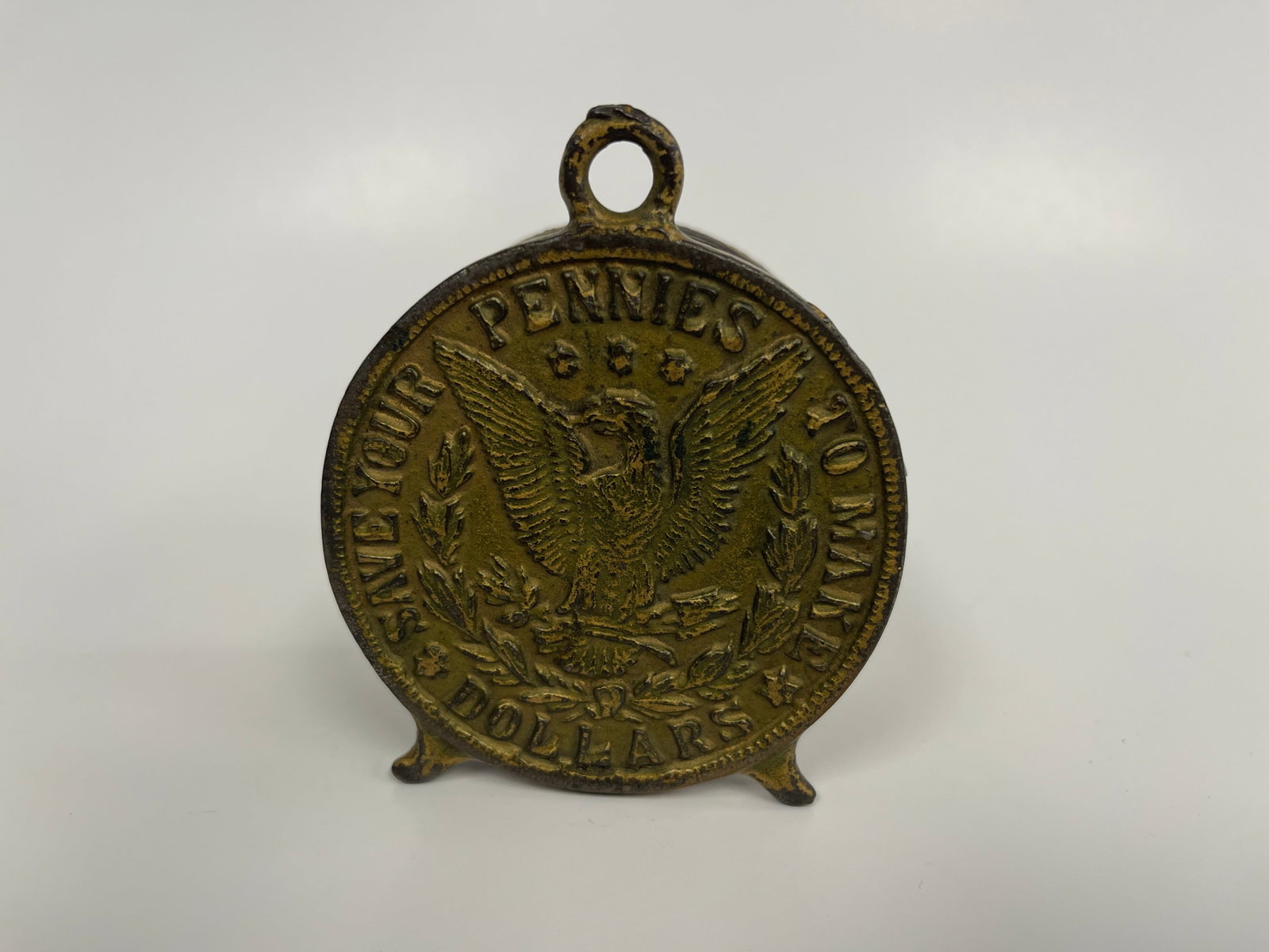 EAGLE EMBOSSED PENNY BANK: EAGLE EMBOSSED PENNY BANK C 1900, CAST IRON, EXCELLENT CONDITION.