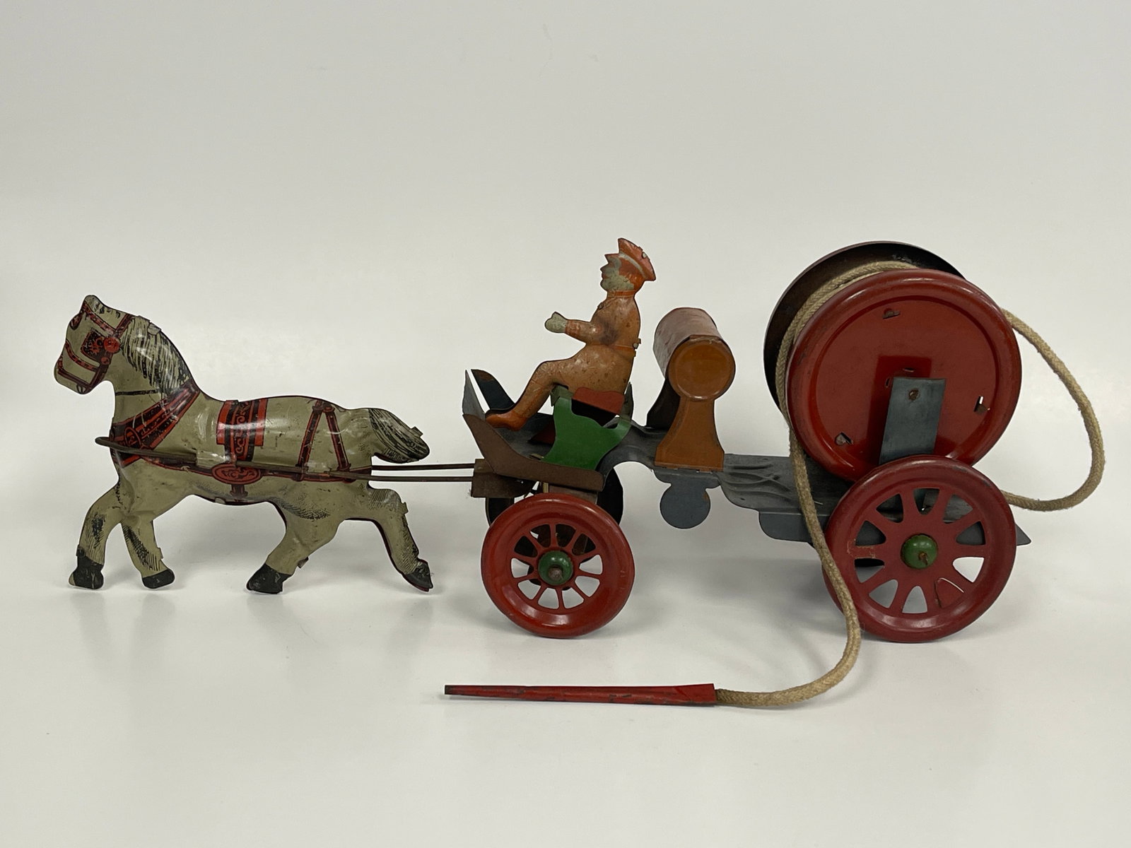 HOSE REEL FIRE WAGON TOY: HOSE REEL FIRE WAGON TOY LATE 19TH C, PRESSED STEEL & COTTON, EXCELLENT CONDITION