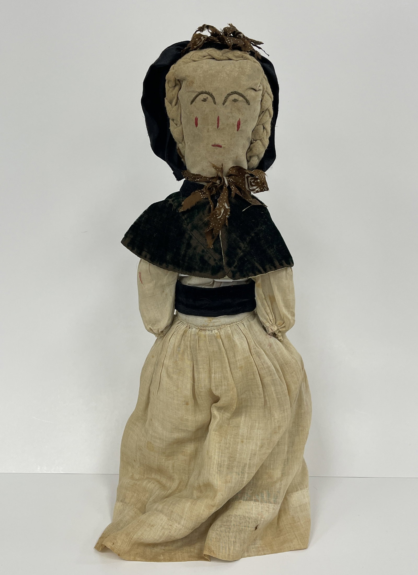 EARLY RAG DOLL: EARLY RAG DOLL 19TH C, EMBROIDERED FACE, IVORY DRESS, BLACK SHAWL & HAT