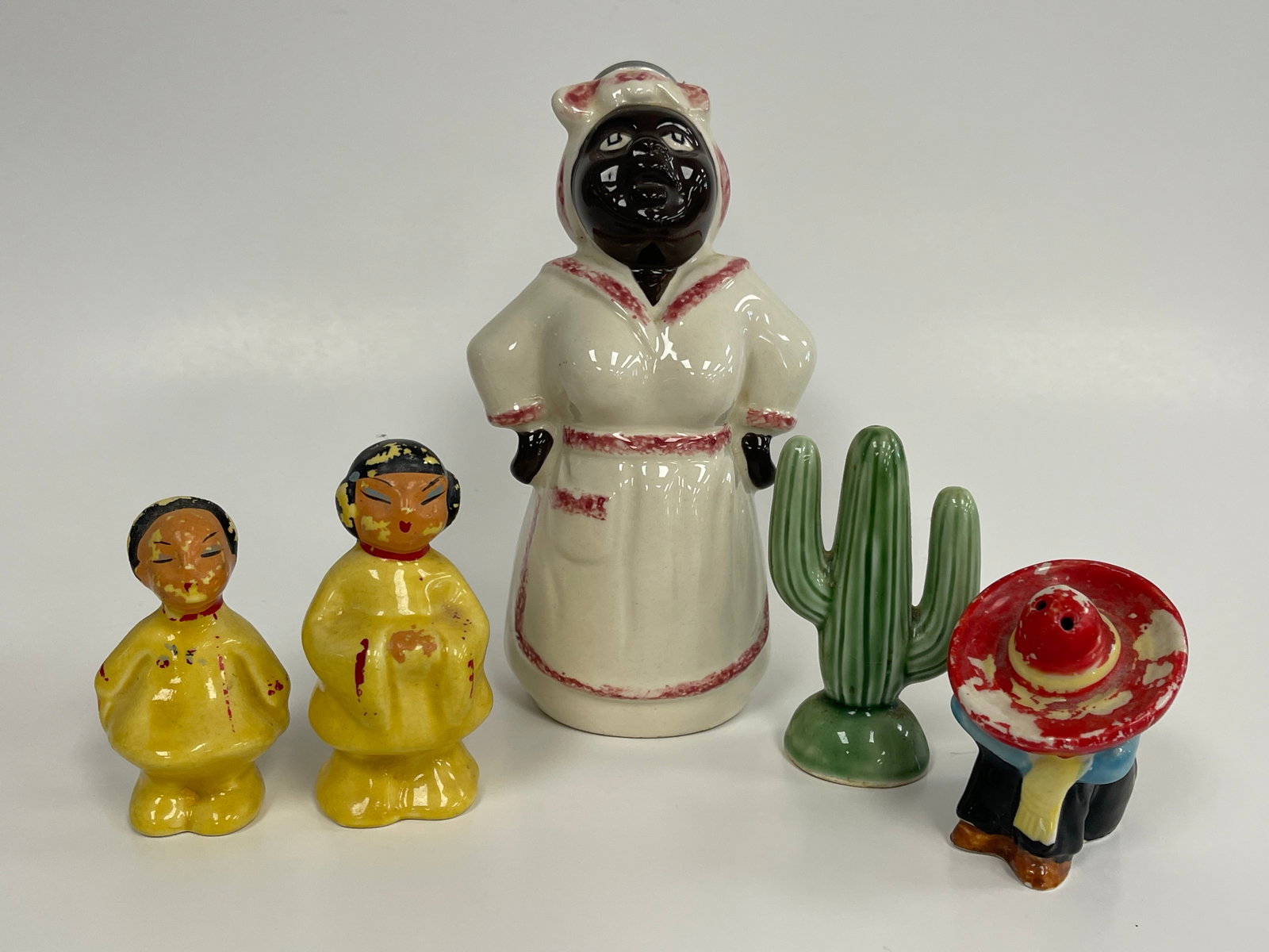 LOT OF 5 CERAMIC FIGURES: LOT OF 5 CERAMIC FIGURES EARLY 20TH C. CLOTHES IRONING WATER SPRINKLER, SW SALT & PEPPER SHAKER, 2 CHINESE FIGURES. VG CONDITION.