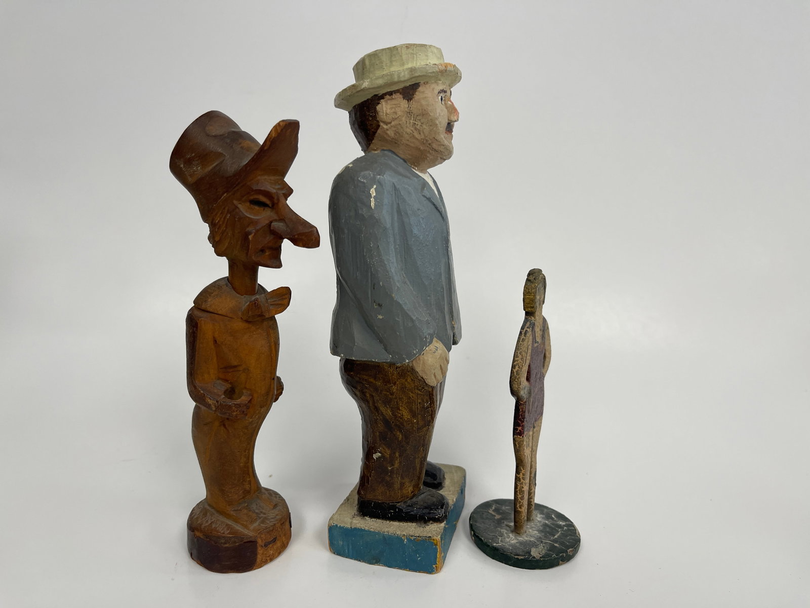 3 CARVED FIGURES: 3 CARVED FIGURES EARLY 20TH C, WOMAN IN BATHING SUIT, CARICATURE MAN, GENT IN BLUE JACKET. EXCELLENT CONDITION.