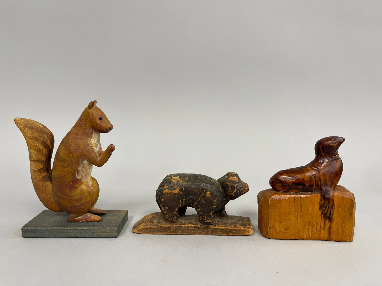 3 SMALL CARVED ANIMALS: 3 SMALL CARVED ANIMALS C 1920’S, SQUIRREL (PAW LOSS), SEAL & BEAR. OVERALL VG CONDITION