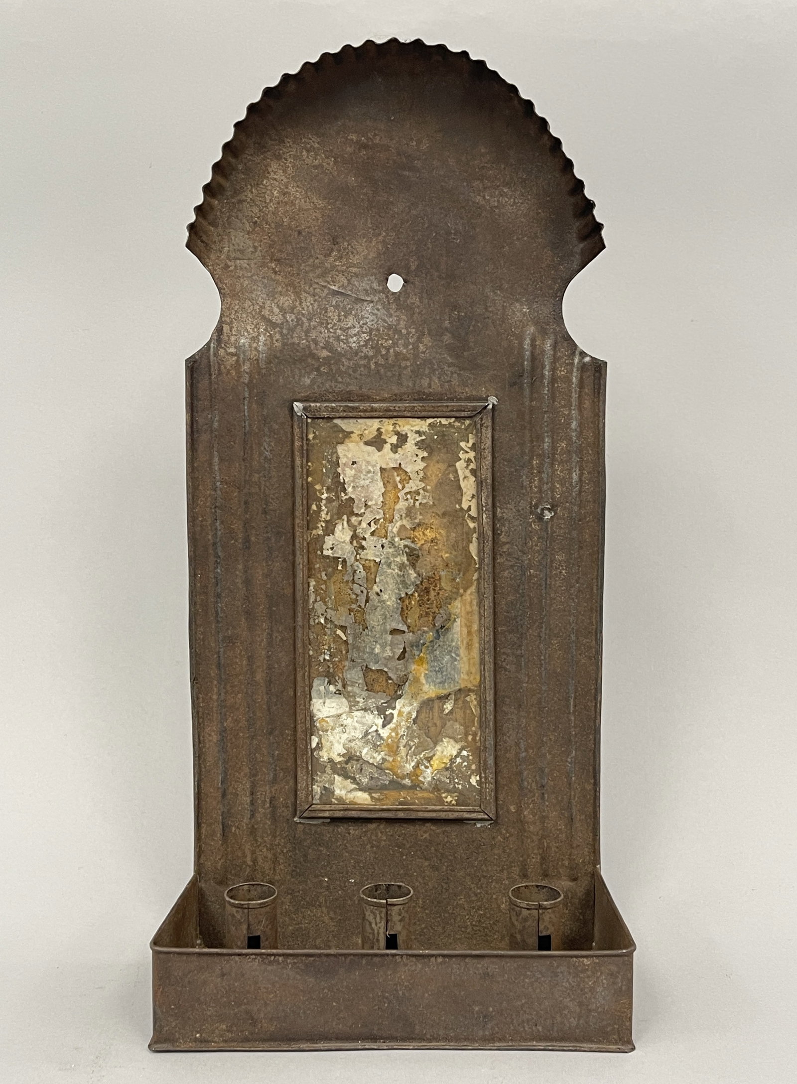 TRIPLE SOCKET MIRRORED CANDLE SCONCE: TRIPLE SOCKET MIRRORED CANDLE SCONCE 18TH C, ROLLED SHEET IRON, TAB CLEATED SOCKETS, ORIGINAL MIRROR PLATE, GREAT UNTOUCHED SURFACES, EXCELLENT CONDITION.