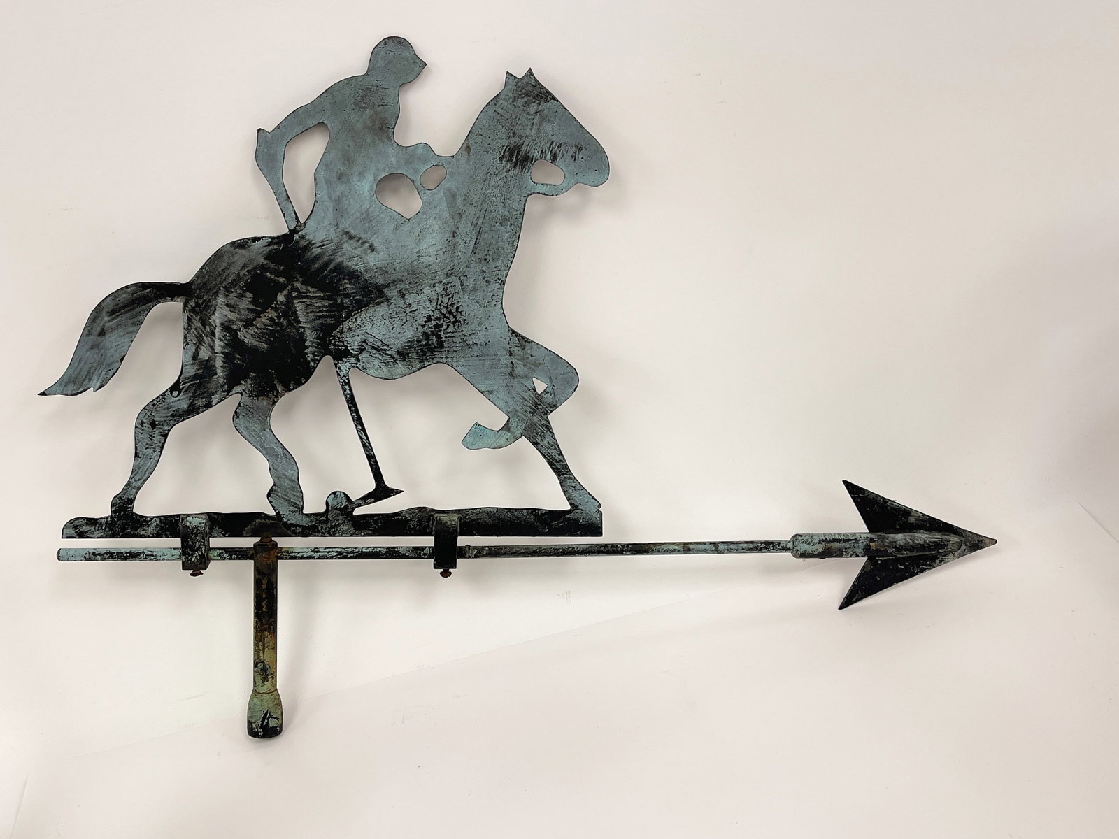 RARE POLO PLAYER WEATHERVANE: RARE POLO PLAYER WEATHERVANE HEAVY GAUGE SHEET BRASS AND BRASS TUBING WORN ORIGINAL DRY BLACK PAINT, VERDIGRIS SURFACES, EXCELLENT CONDITION 16 X 23