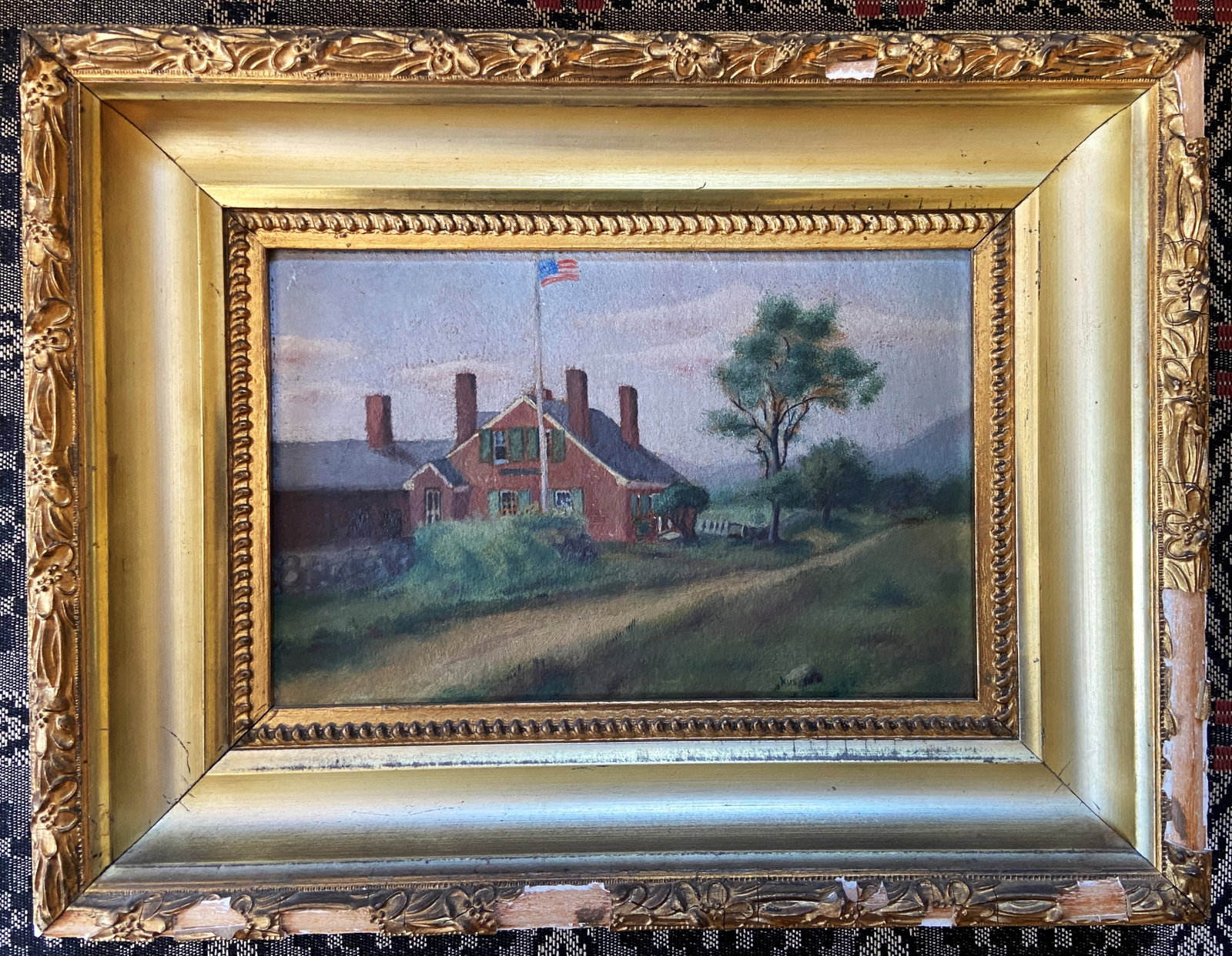 PAINTING ON BOARD OF HOMESTEAD WITH AMERICAN FLAG: PAINTING ON BOARD OF HOMESTEAD WITH AMERICAN FLAG 9" X 7" FRAME 14" X 10"