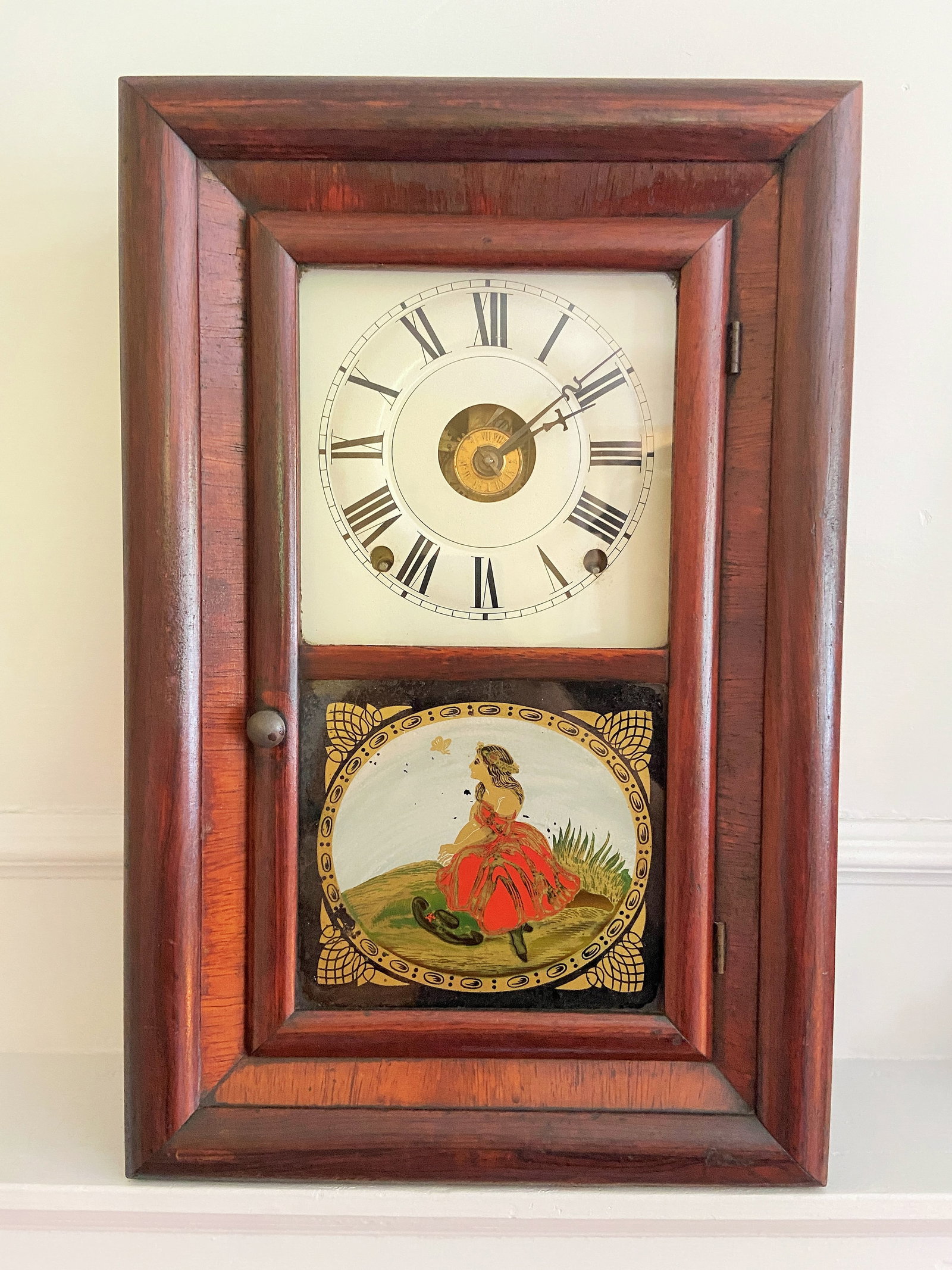 WALL CLOCK OF WOMAN SITTING IN A PRAIRIE: WALL CLOCK OF WOMAN SITTING IN A PRAIRIE 11" X 16" X 13"