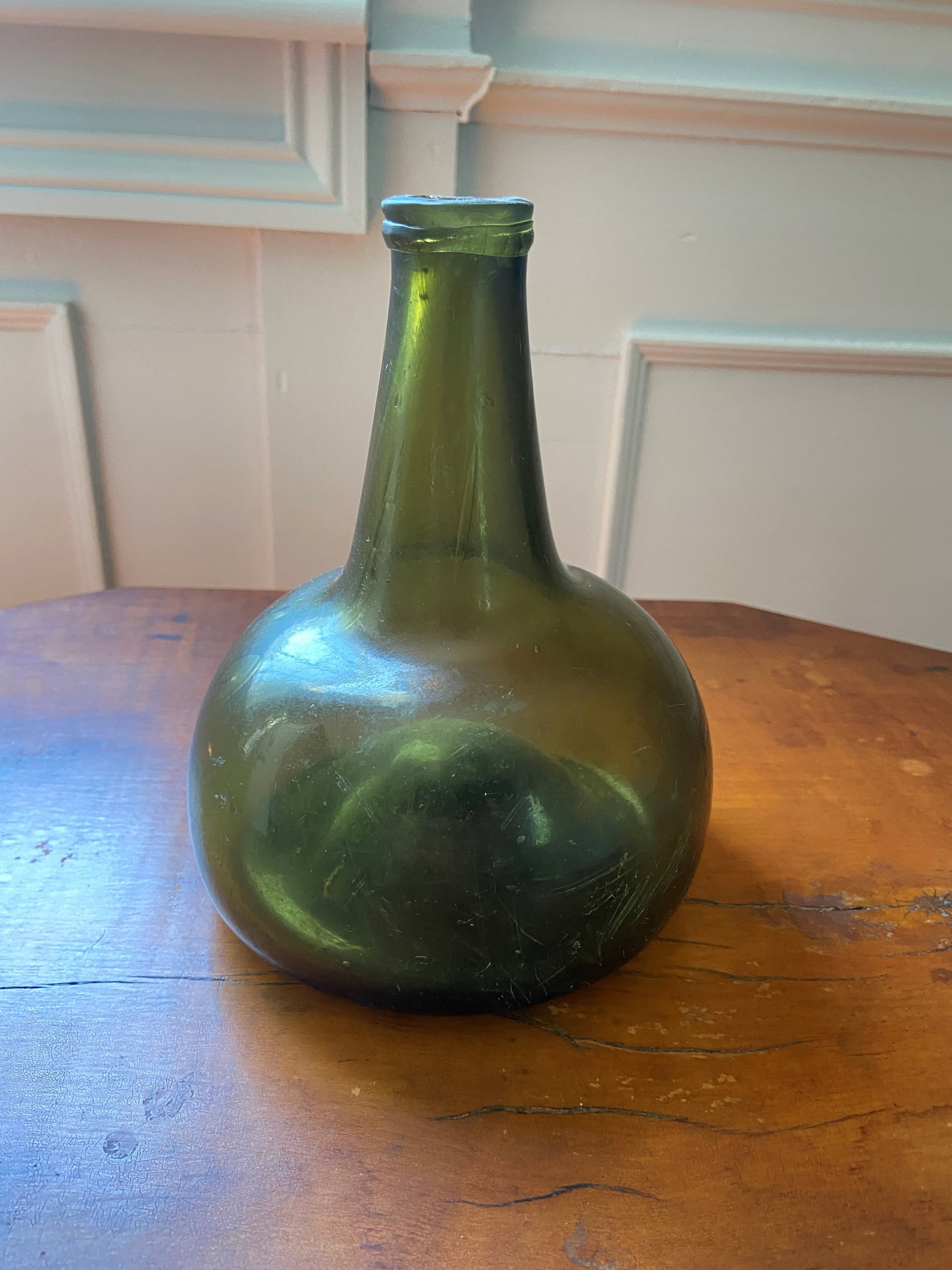 EARLY GREEN GLASS BOTTLE: EARLY GREEN GLASS BOTTLE SMALL KNICK IN TOP 8"