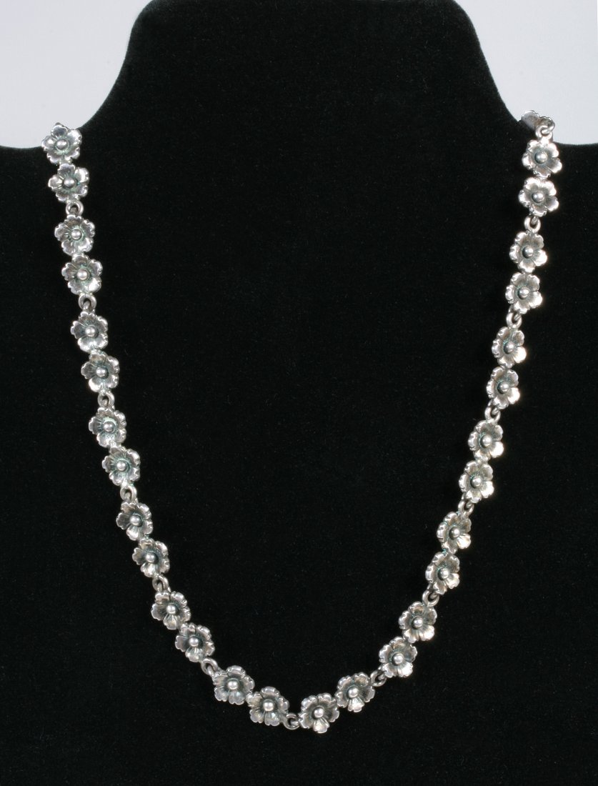 Danish Sterling Necklace by N.E. From - Mid-Century Design: Sterling silver necklace by Danish maker, N.E. From. Circa 1950s-1960s. Nineteen double flower links create a simple, classic Scandinavian design. Hoop and bar clasp. Marked on the back: "Sterling - D
