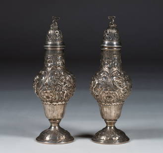 Antique NeoClassical Design Silver Hand-Chased Shakers / Casters - Hallmarked: A pair of large fancy silver or silver-plated casters or master shakers decorated with Cherubs and ornate Neo-Classical designs. Mythical dolphin finials. All hand-chased and crafted. European 19th ce