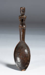 Ifugao Carved Figural Spoon - Philippines Early 20th Century: Carved wood spoon with a powerful looking ancestor figure carved on the top of the handle. Ifugao People, Phillipines. Early 20th century. Highly stylized rendition and well-used with dark smooth surf