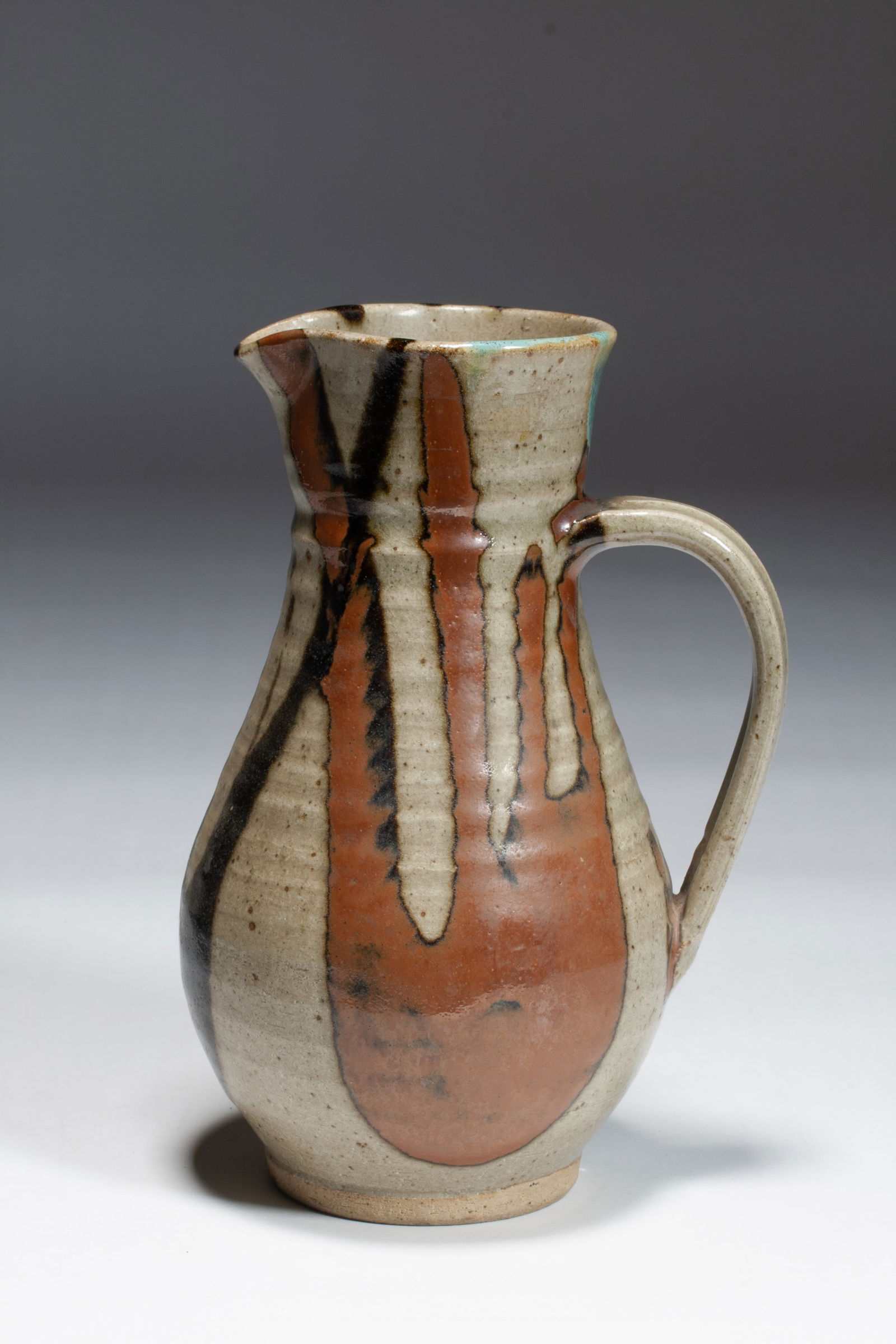 Japanese Ceramic Pitcher - Shoji Hamada? - Mingei Studio Pottery: A fine Japanese Mingei studio pottery pitcher, possibly by master Japanese potter, Shoji Hamada (1894-1978). Glazed stoneware. Mid 20th Century. Unsigned. No box. Beautifully hand-thrown, crafted and