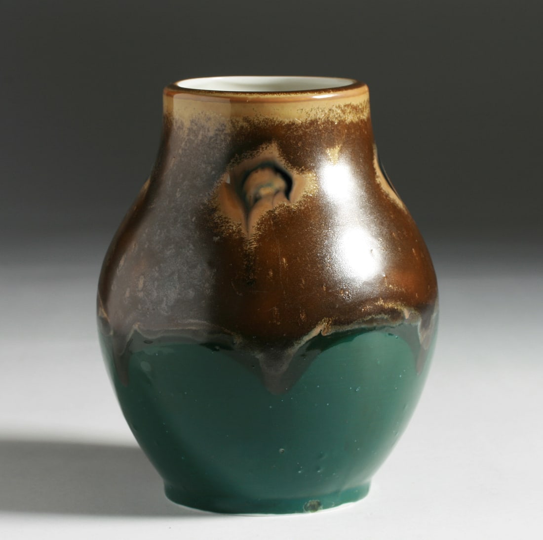 German Arts & Crafts Art Pottery Vase - Circa 1910: Arts and Crafts vase by Rodental Kunstwerkstatte Wilhelm Goebel. Germany, circa 1910. Porcelain art pottery vase with a complex semi-matte crystalline glaze in the Darmstadt manner. Signed with the fa