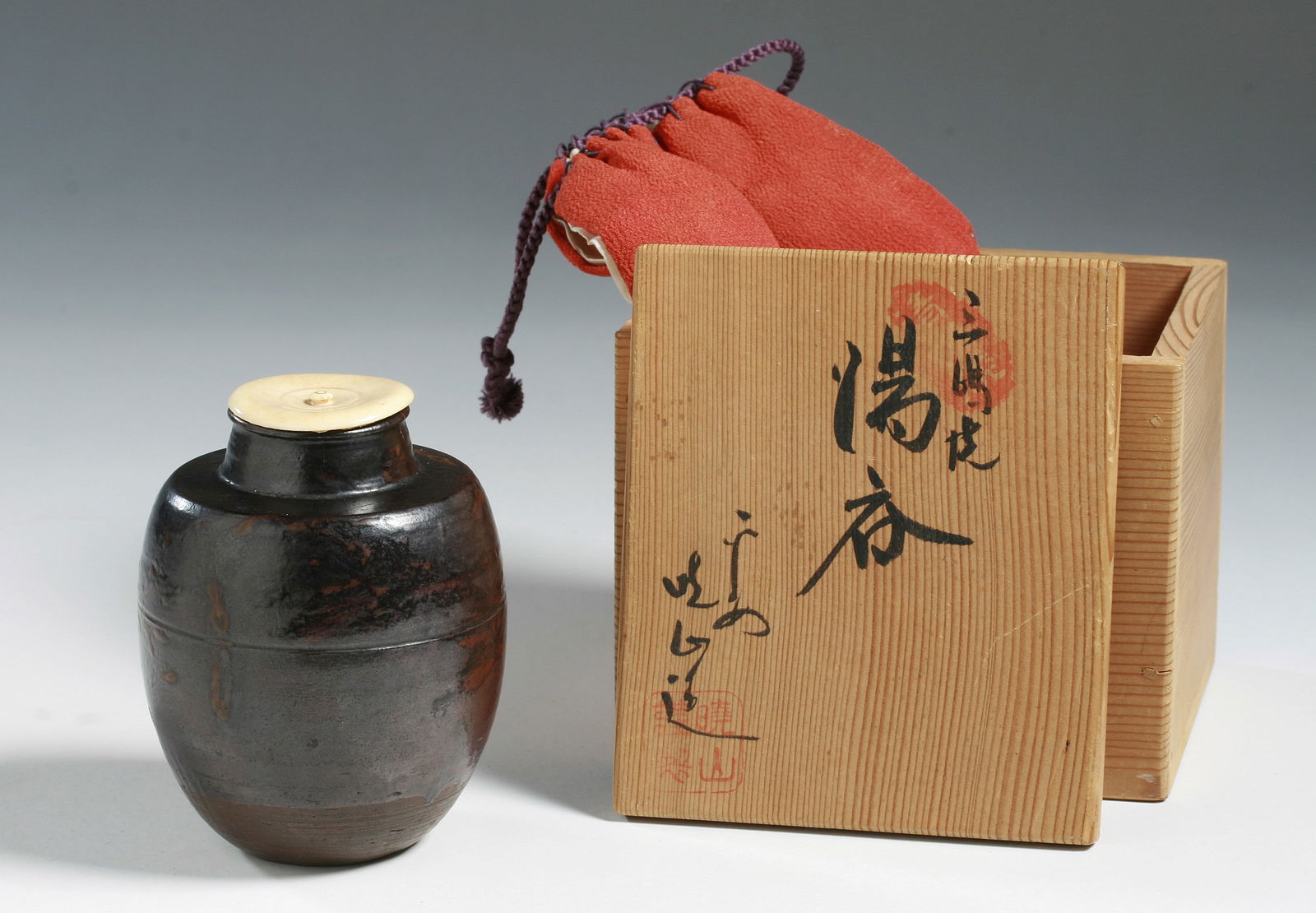 Japanese Pottery Karatsu Tea Caddy with Box - 18th Century: Fine Japanese Karatsu ware ceramic Tea Caddy or Chaire with original lid. Tokugawa Era - 18th Century. Housed in a red silk cloth bag with purple silk ties, and in a signed collectors box with calligr