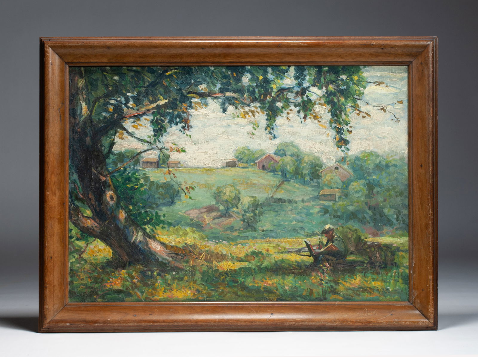 Frederick William Kost (1861- 1923) American Impressionist Landscape: Frederick William Kost (American, 1861- 1923). Impressionist landscape painting with a man painting or drawing under a tree (possibly a self portrait). Circa 1910. Oil on canvas. Framed. Signed lower