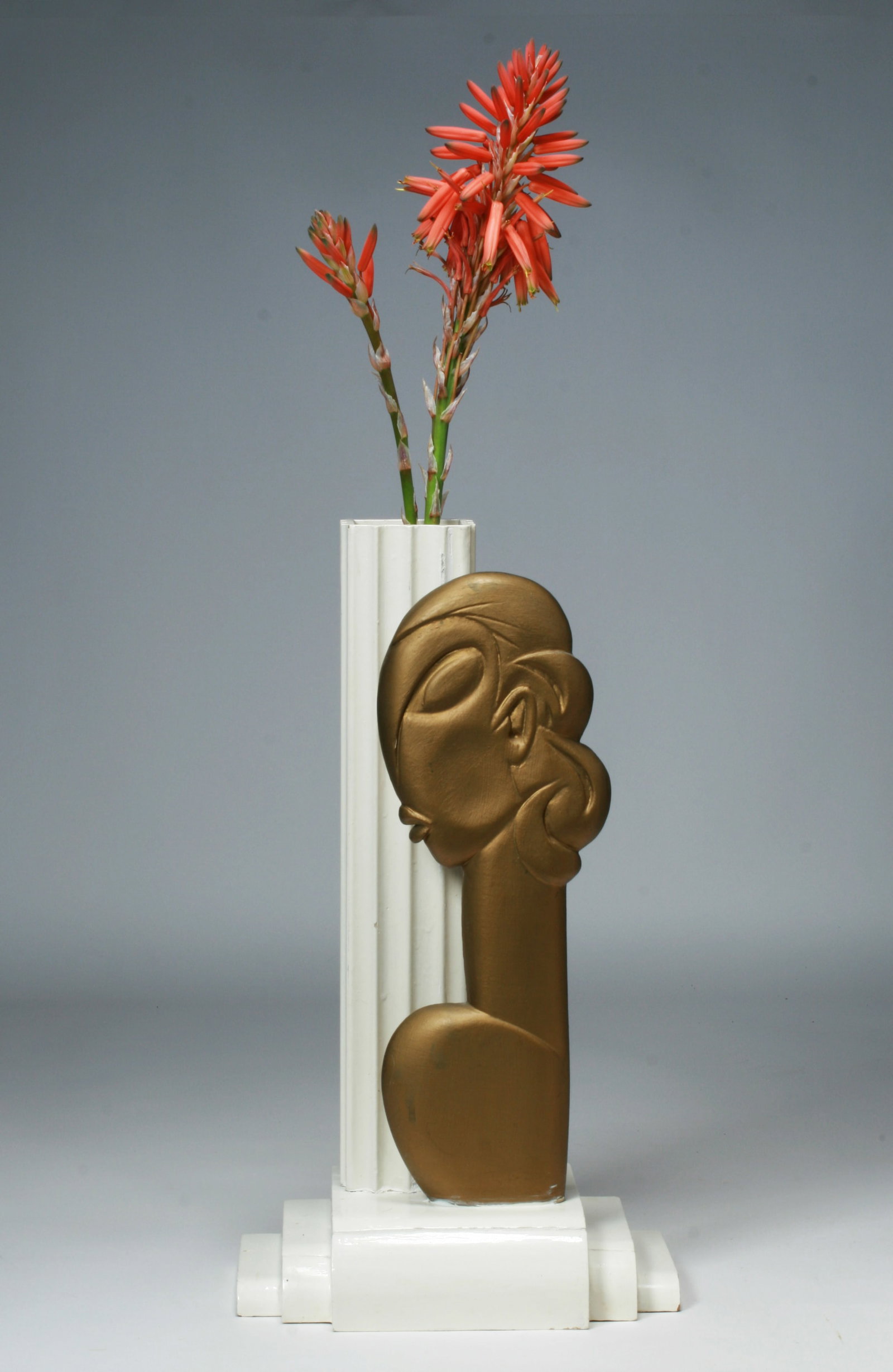 Art Deco Jazz Age Sculpture of Josephine Baker 1930's: A sculptural hand-made and painted wood weed or flower holder in the form of the Jazz Age dancer, Josephine Baker. Circa 1930. High style Art Deco. White gloss-painted wood base and vertical column ho