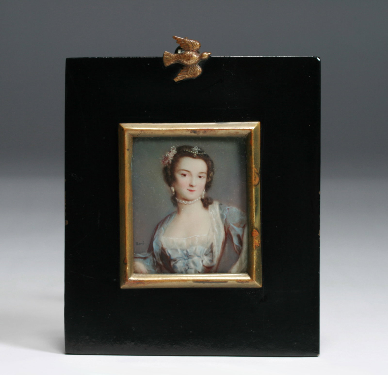 French Minature Painting by Andre Rene - Lady with Pearls - 19th Century: A fine miniature portrait by French artist, Andre Rene (19th Century). Watercolor in a black lacquer and gilt bronze frame, decorated with a small gilded bronze dove. Signed lower left "Rene". Late 19