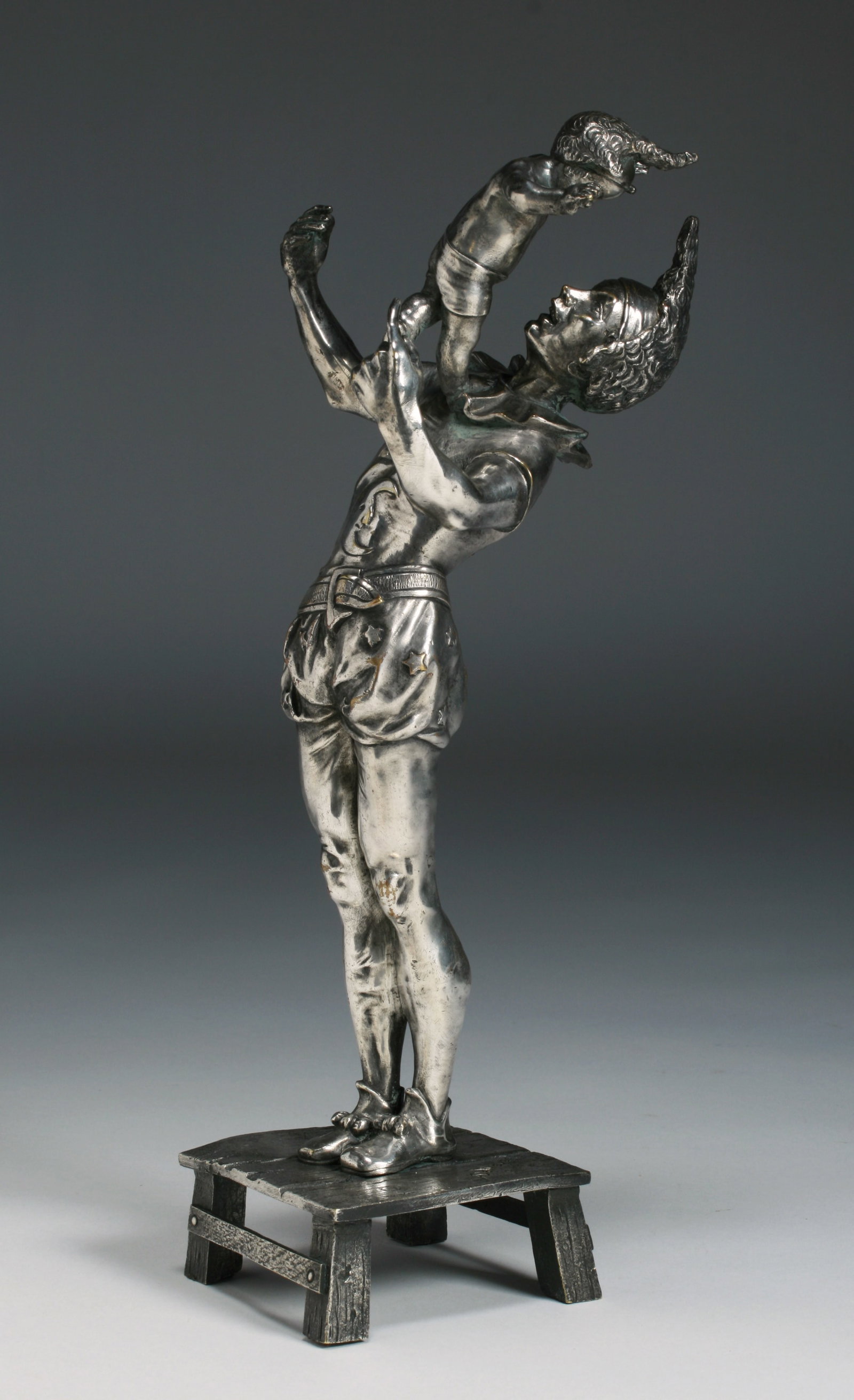 Auguste DeWever (1836-1910) Silvered Bronze Sculpture "Mephistopheles": A fine Art Nouveau silvered bronze sculpture of Mephistopheles playing with a child by French Belgian artist, Auguste DeWever. Circa 1890. Bronze with a silver surface. Signed "A Dewever / Bruxelles" 