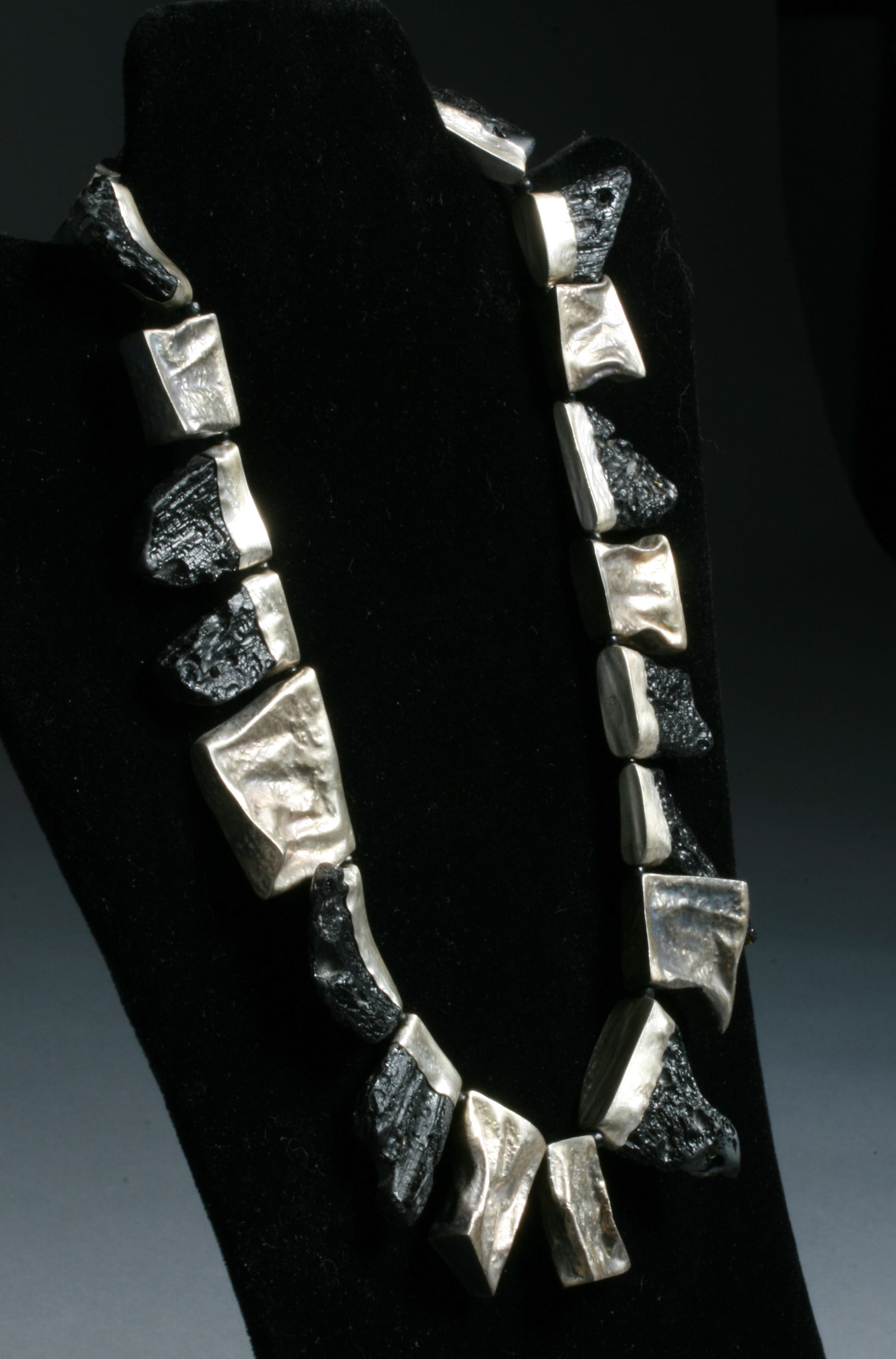 1990's Brutalist Necklace - Black Tektite Meteorite Glass & Sterling: A great Brutalist necklace designed with twelve bezel-set Tektites and six crushed sterling silver boxes of various dimensions. Unmarked, unsigned. Artist unknown. From a New York City, Upper East Sid