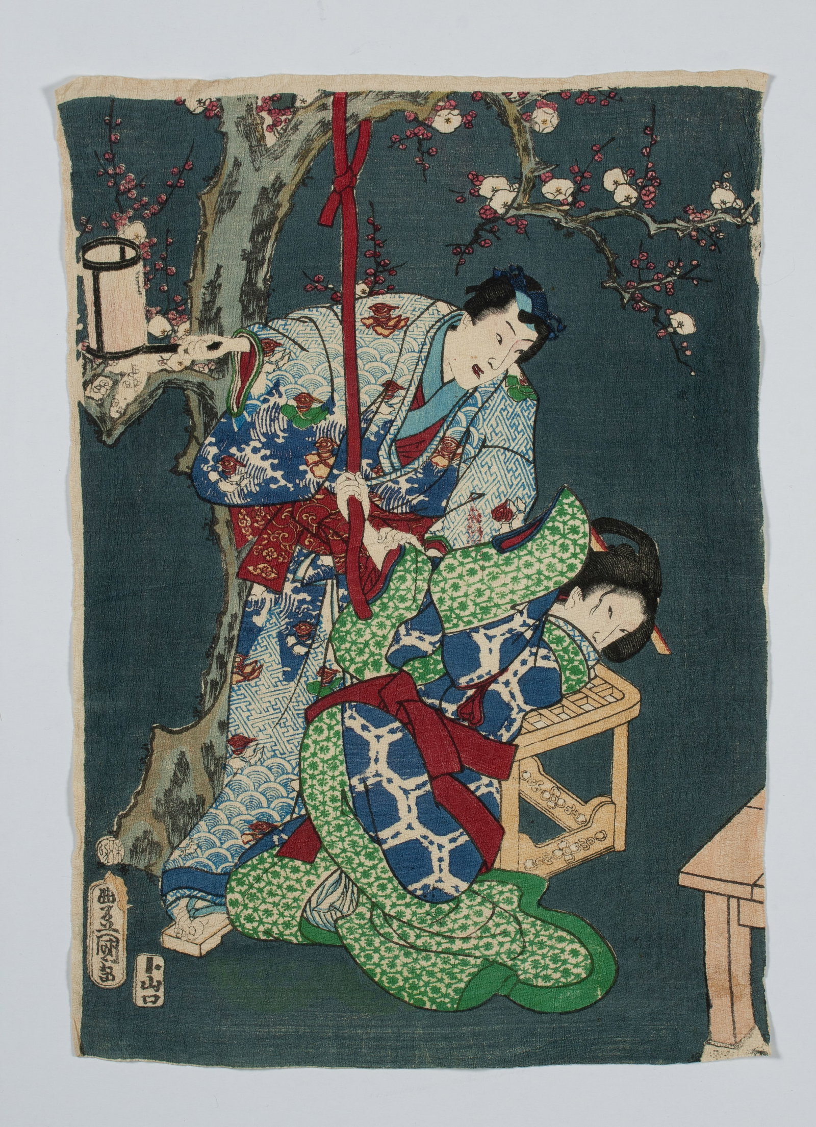 Kunisada Utagawa - Antique Japanese Woodblock Print - Two Figures: Antique Japanese woodblock print by Kunisada Utagawa (1786-1865). Printed in colors on a crepe textured thin paper. The print depicts two interacting figures, one kneeling over a chair or table. Seale