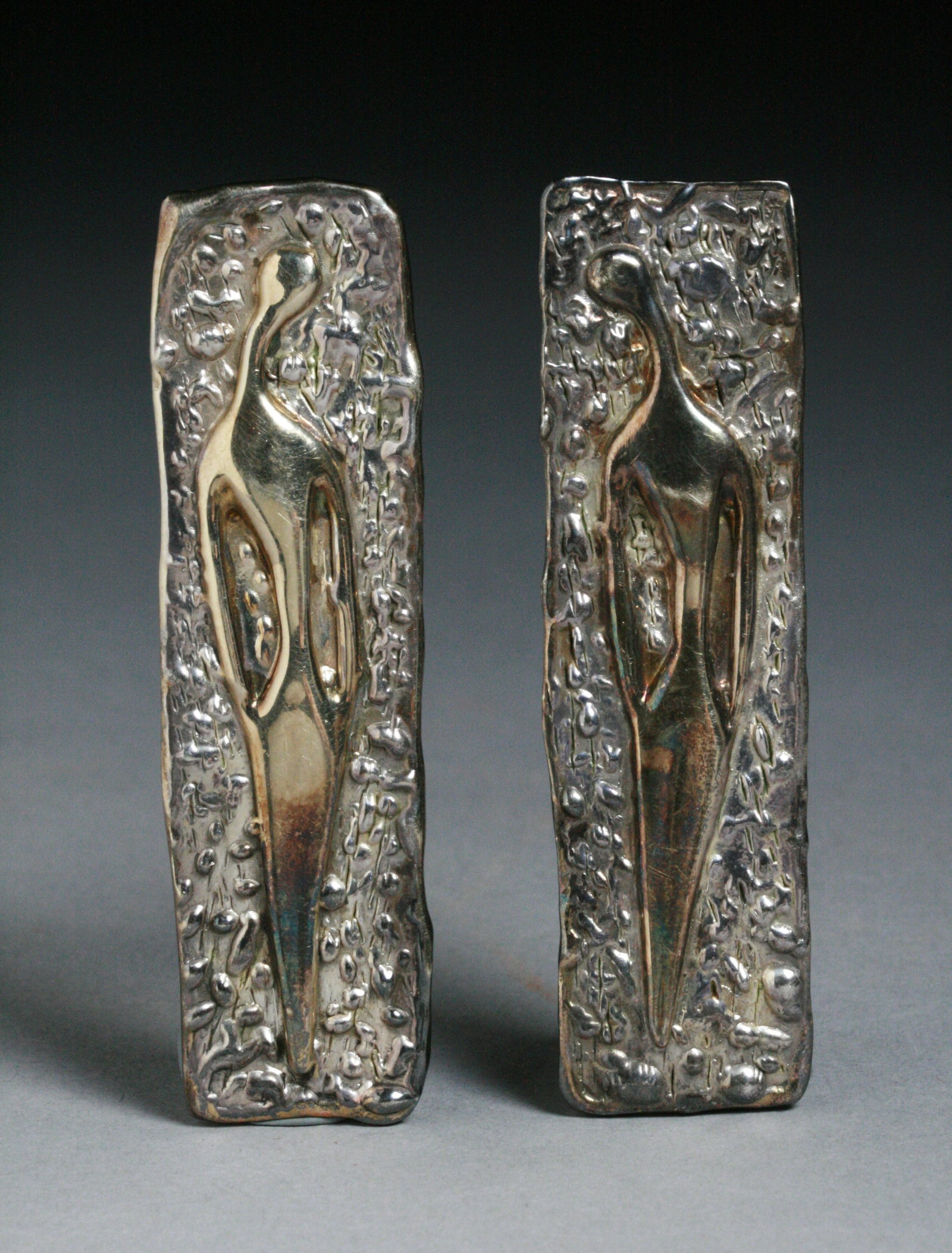 Ruth Bloch Modernist Sculptural Earrings - Women 1980's: A pair of modernist sterling fearrings by well known sculptor and jeweler, Ruth Bloch (Israeli - American b. 1951). Designed with electro-formed elongated female figures in the style of Giacometti. Cl