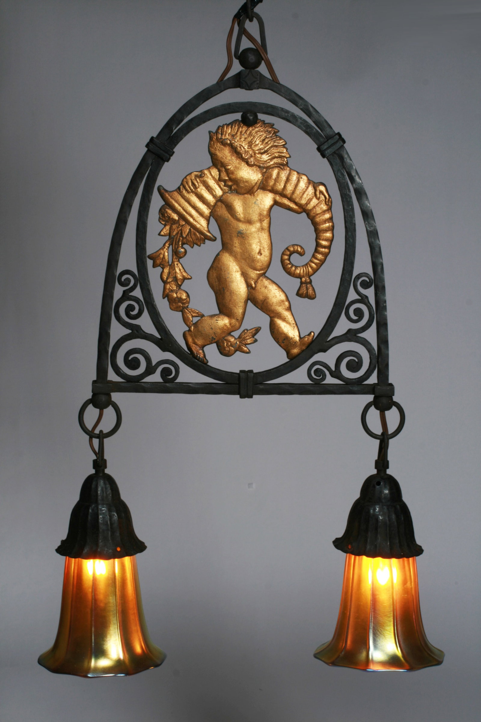 Wrought Iron Arts & Crafts Hanging Lamp - Steuben Shades 1910: A fine Arts and Crafts - Art Deco wrought iron hanging lamp with signed Steuben iridescent art glass shades. Circa 1910. Possibly attributable to Oscar Bach (1884-1957) in New York City. Unsigned. Fea
