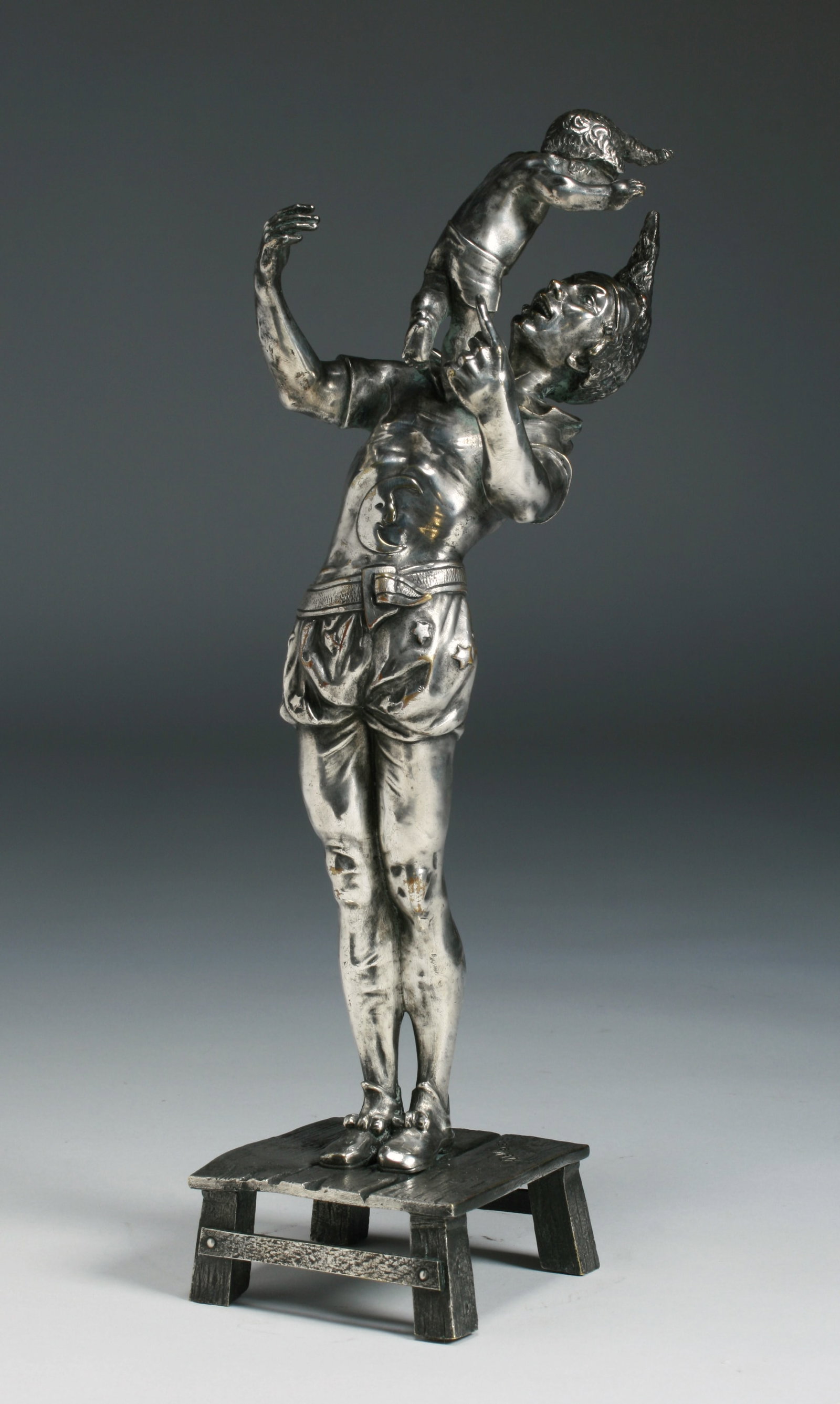 French Art Nouveau Silver Bronze Sculpture - Auguste DeWever: Art Nouveau silver-on-bronze sculpture of Mephistopheles playing with a child by French Belgian artist, Auguste DeWever. Circa 1890. Bronze with a silver wash. Signed "A Dewever / Bruxelles" on the