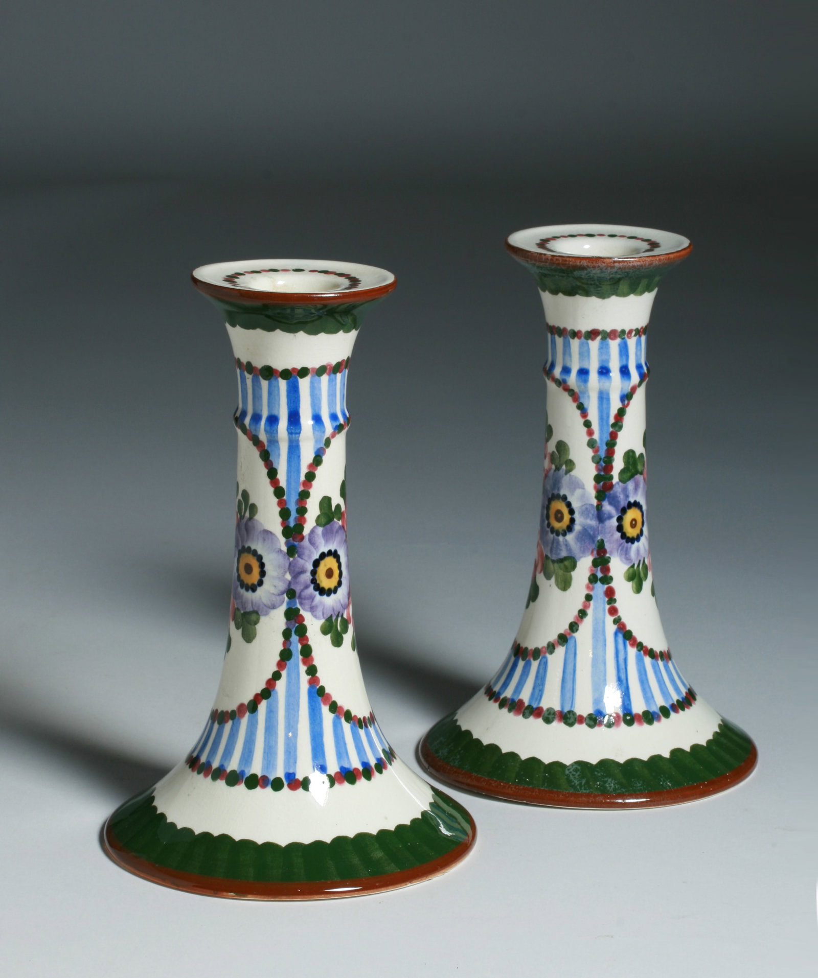 Arts & Crafts Pottery Candlesticks - Circa 1910 - loral Design: Hand-painted ceramic candlesticks dating to the Arts & Crafts / Jugenstil period. Circa 1910. Made with the Rotenburg decor in Annaburg, Germany. Signed on the bottom of each candlestick. Height : 7