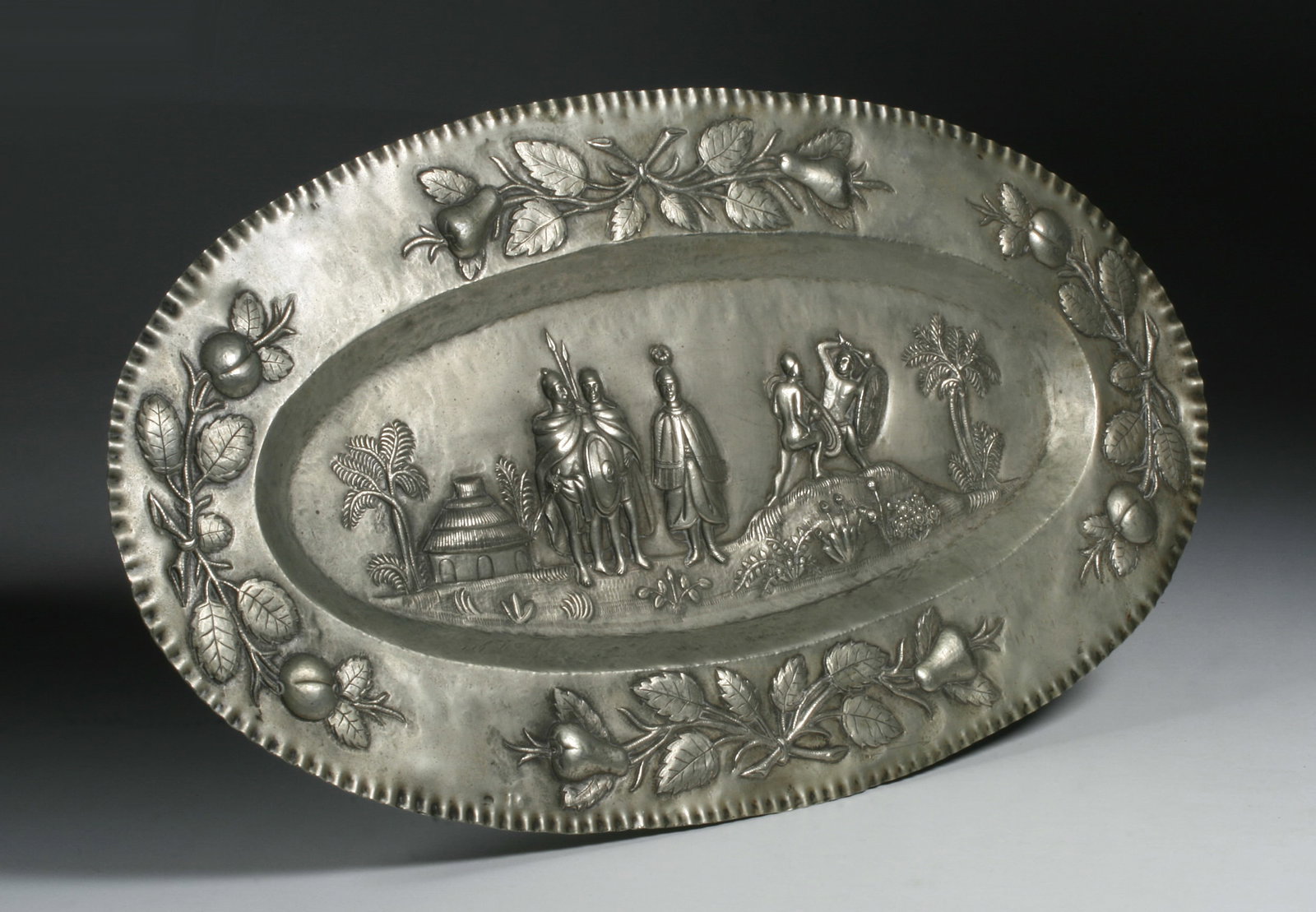 Continental Silver Tray with Tribal Scene - 19th Century: Antique European silver tray with a central repousse design depicting a tribal scene (possibly an African view of the Wolof culture of Senegal). 19th century. Possible hallmarks to reverse near the ed