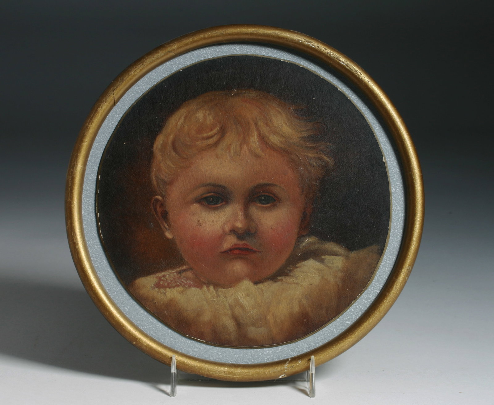 19th Century American Folk Art Painting - Portrait of a Child: Small round American folk art painting of a child. Late 19th century. Finely painted. Oil on slateboard, mounted onto board. Framed. Unsigned. Painting : 7" diameter Frame : 8 1/2" diameter CONDITION 