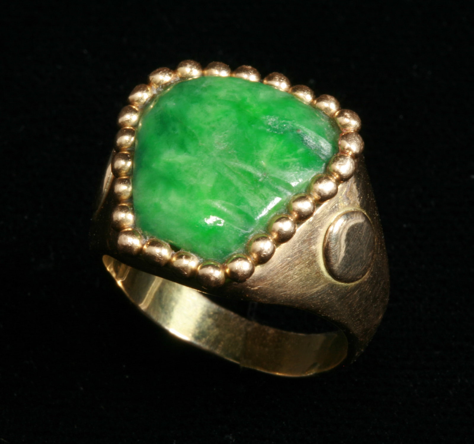 William Spratling 18K Gold & Pre-Columbian Jade Ring - Mexican: A fine and rare Mexican gold and jade ring by William Spratling. Circa 1960's Taxco, Mexico. Signed on the inside of the band. Marked 18K - WS. A beautiful design, as always with Spratling, featuring 