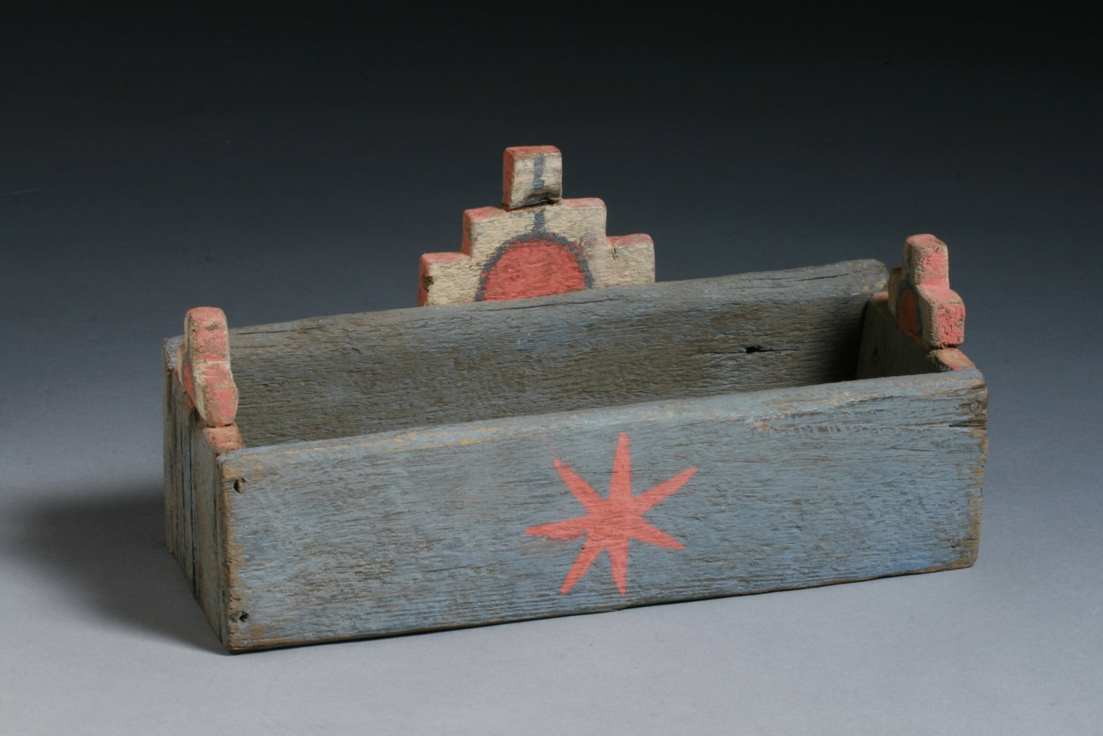 Hopi Native American Tableta Box - Early - Mid 20th Century: An unusual Hopi painted wood box decorated with a painted star on the front and tablita style designs on the back and sides. Early to mid 20th century. First Mesa Arizona. Old and worn. Purpose unknow