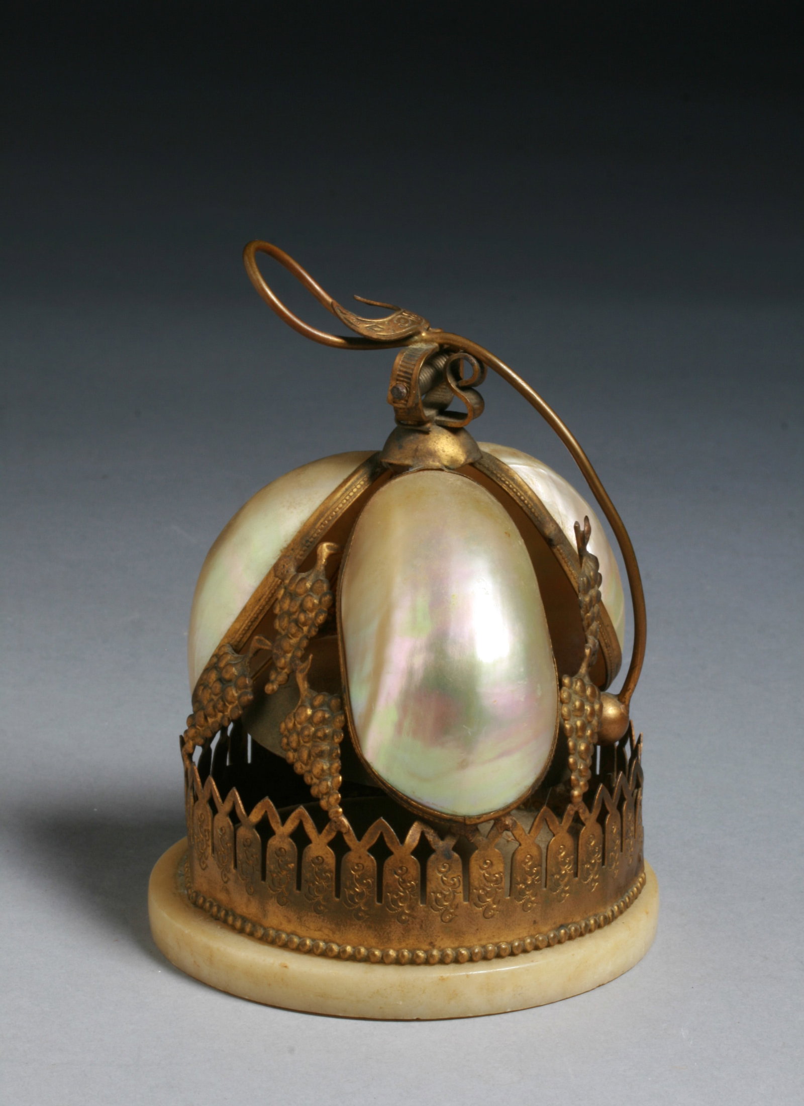 French Palais Royale Dinner Bell - 19th Century Paris: A 19th century French Palais Royale dinner, butler's, wine or desk bell. Gilt bronze ormolu mounts with designs of grapes and iridescent Mother of Pearlseashell body with a small bell inside. Round al
