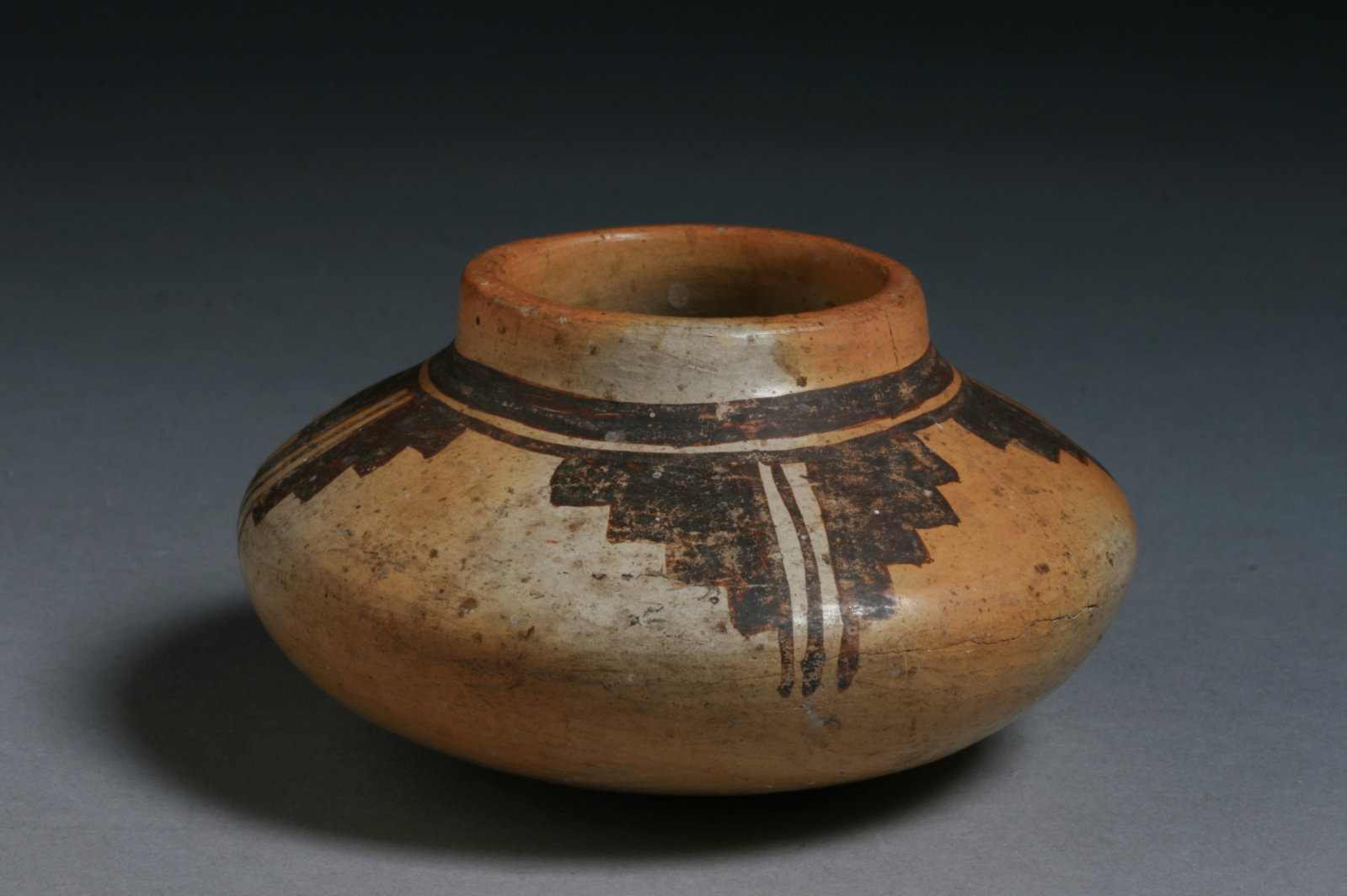 Small Old Hopi Pottery Jar - Native American: A small, but very old Hopi pottery jar decorated with four stepped designs. Late 19th or early 20th century. No signature. Diameter : 3 5/6" PROVENANCE : Private collection. CONDITION : Small, tight h