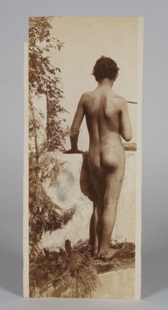 Wilhelm Von Gloeden (1856-1931) - Photograph of a Boy: Photograph of an Italian boy standing with his hand on a wall by Baron Wilhelm Von Gloeden (1856-1931). Salt print on drawing paper. Not mounted or framed. Unsigned on the front. Photographer’s blin