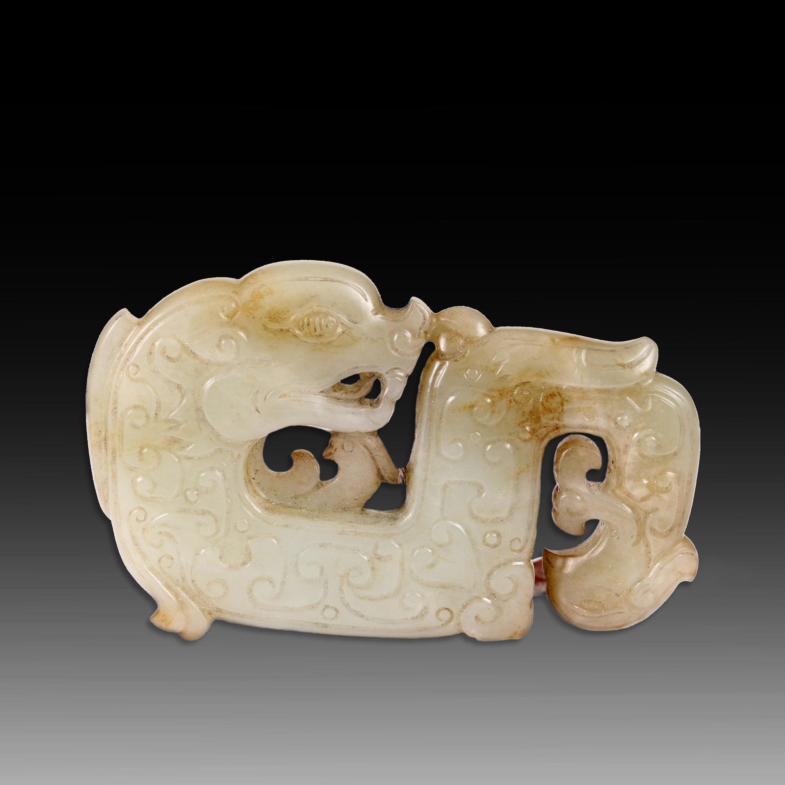 A CHINES CARVED DRAGON PATTERN WHITE JADE PENDANT. (1 of 8)