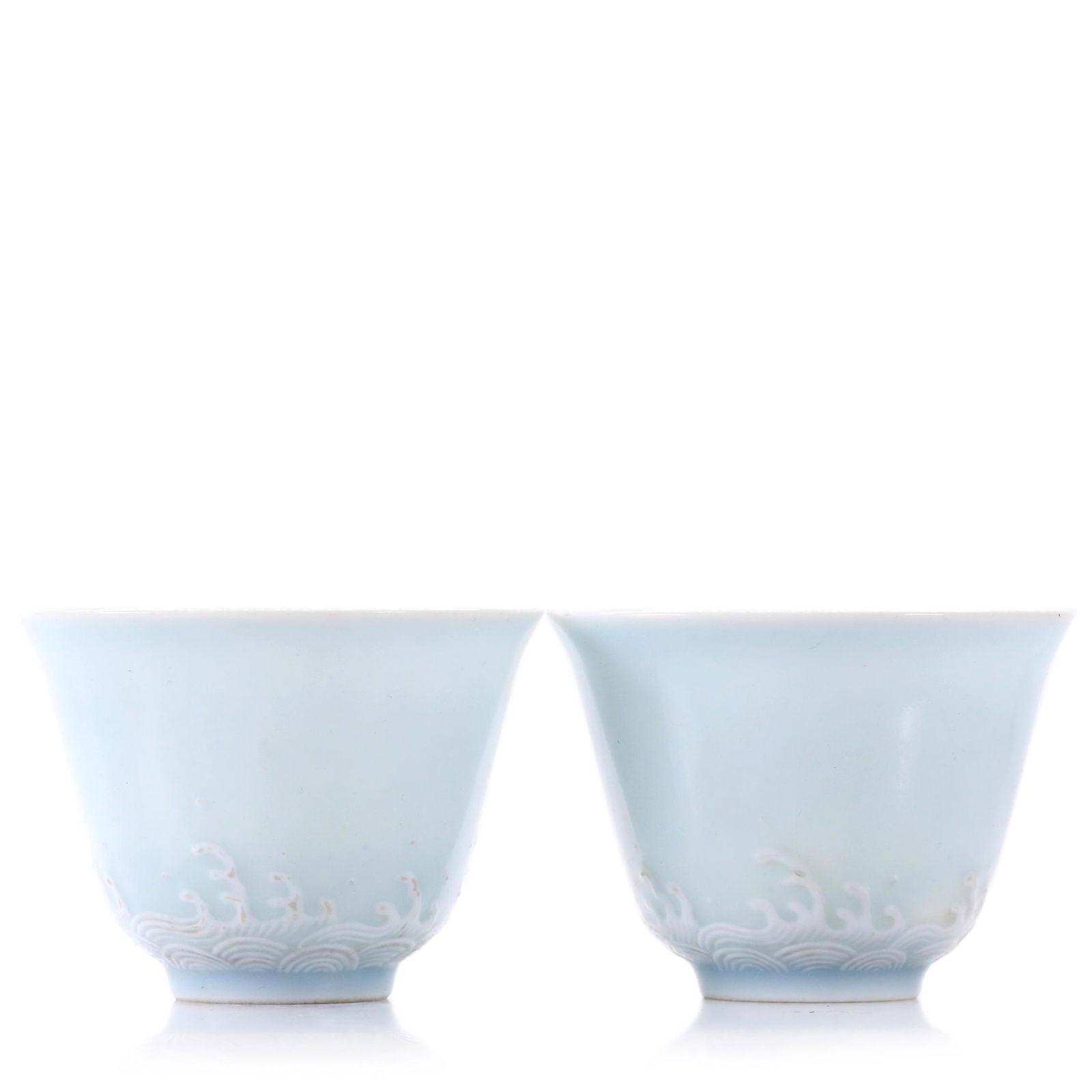 A Pair Of Sky Blue Glazed Cups: Diameter 7 cm, height 5 cm.