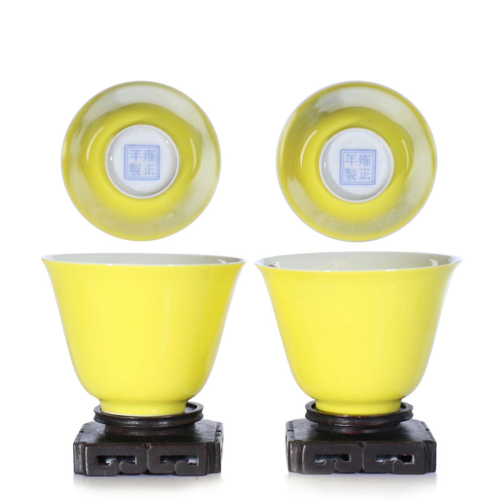 A Pair Of Chinese Yellow Glazed Wine Cups With Zitan Hardwood Stand: D 6 cm, H 4.5 cm, 6 cm including stand.