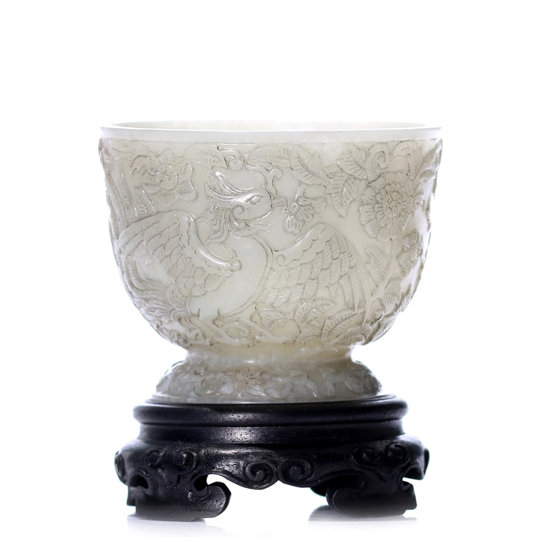 A Chinese White Jade Carved Cup With Stand: H 5 cm, D 6 cm, height including accessories 7 cm.