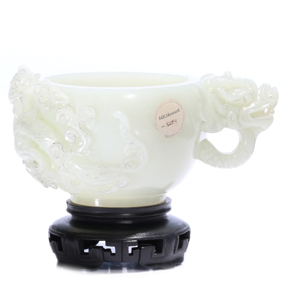 A Chinese White Jade Carved Cup With Stand: 11 x 7.5 x 5 cm, height including accessories 7.5 cm.