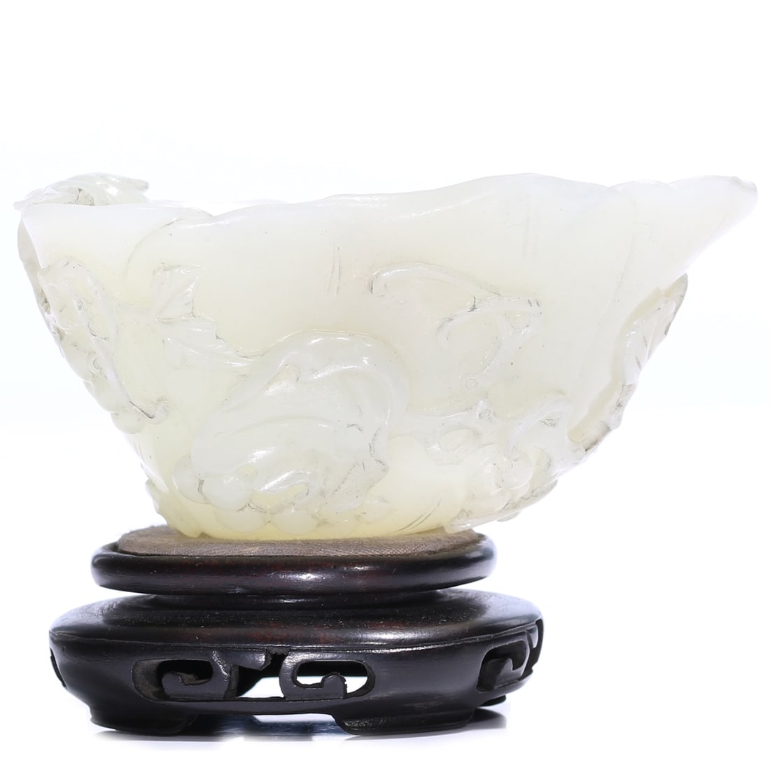 A Chinese White Jade Carved Cup With Stand: 8.4 x 5 x 4.5 cm, height including accessories 7 cm.