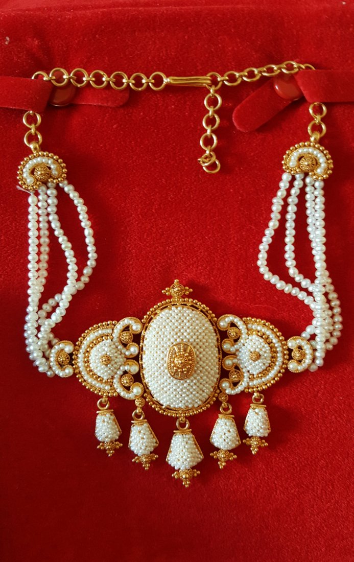 Vintage Rare Gold Multistrand Keshi Pearl Choker,1900s: A vintage rare 22K gold and pearl choker, composed of four strands of natural pearls and an intricate and beautifully detailed filigree setting paved natural seed pearls, suspending from multi gold ta