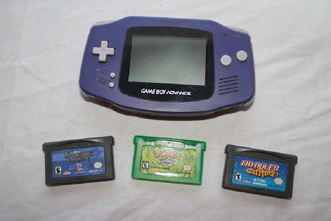Gameboy Advance lot: Purple Gameboy with Pokemon Leaf Green, No Rules Get Phat, and Treasure Planet. Handheld system is missing battery cover. System is tested and works.