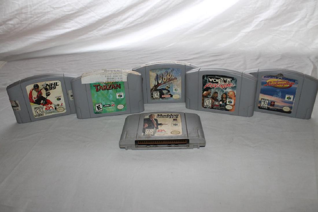 Lot of six Nintendo 64 games: Automobile Lamborghini, 1080 Snowboarding, Madden 64, Tarzan, WCW Revenge, and NHL 99.